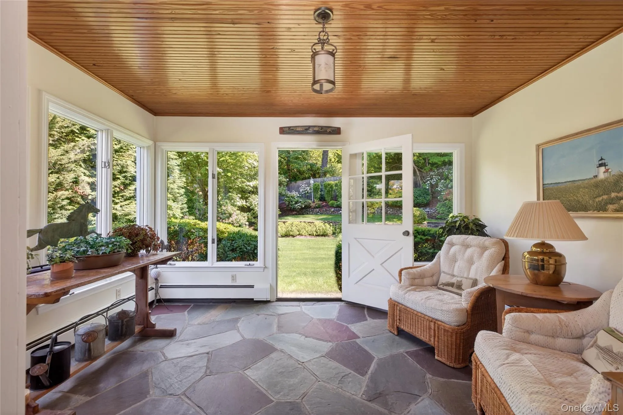 Year-round sun room with bluestone floor Year-round sun room with bluestone floor
