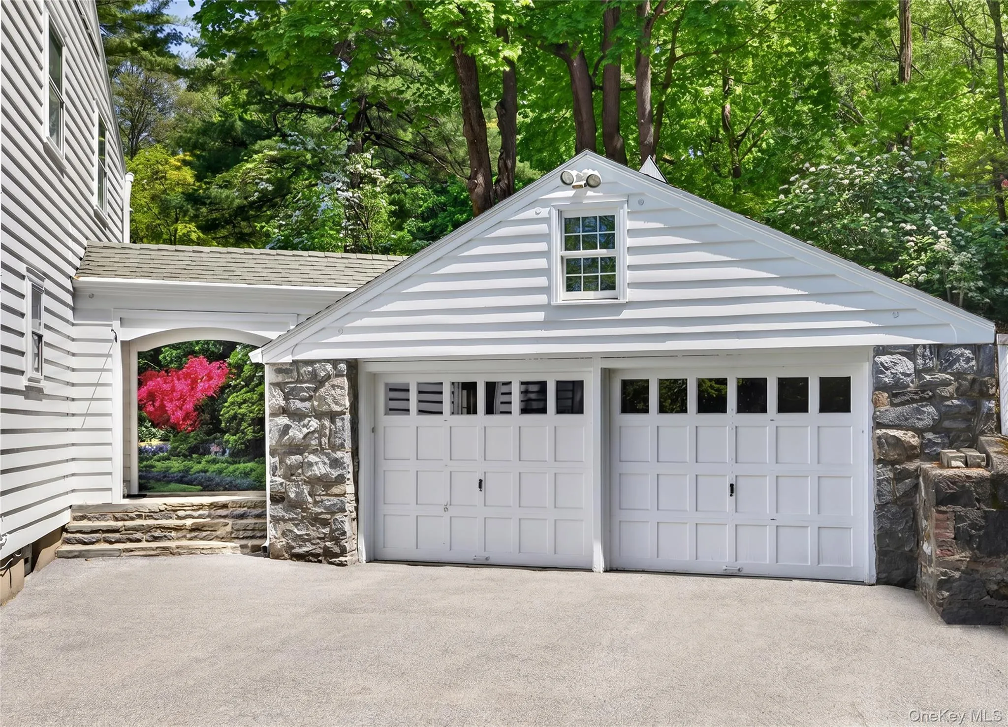 Detached 2-car stone garage with ample attic storage above Detached 2-car stone garage with ample attic storage above