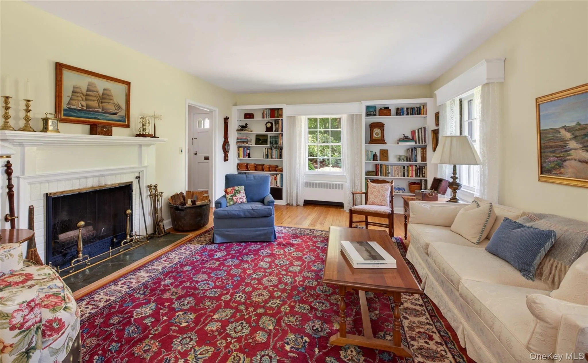 Expansive living room with wood-burning fireplace Expansive living room with wood-burning fireplace