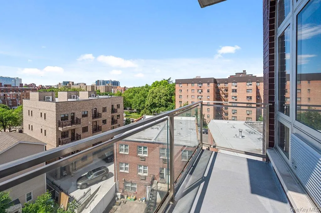 Contemporary balcony featuring a glass railing system and durable surfacing Contemporary balcony featuring a glass railing system and durable surfacing