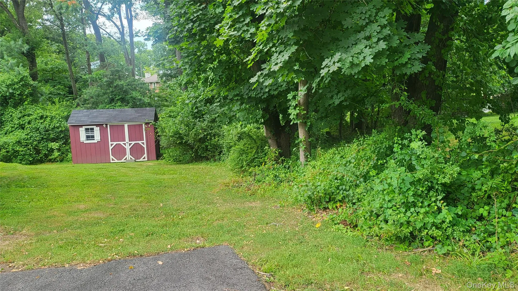 Another view of storage shed from front driveway Another view of storage shed from front driveway