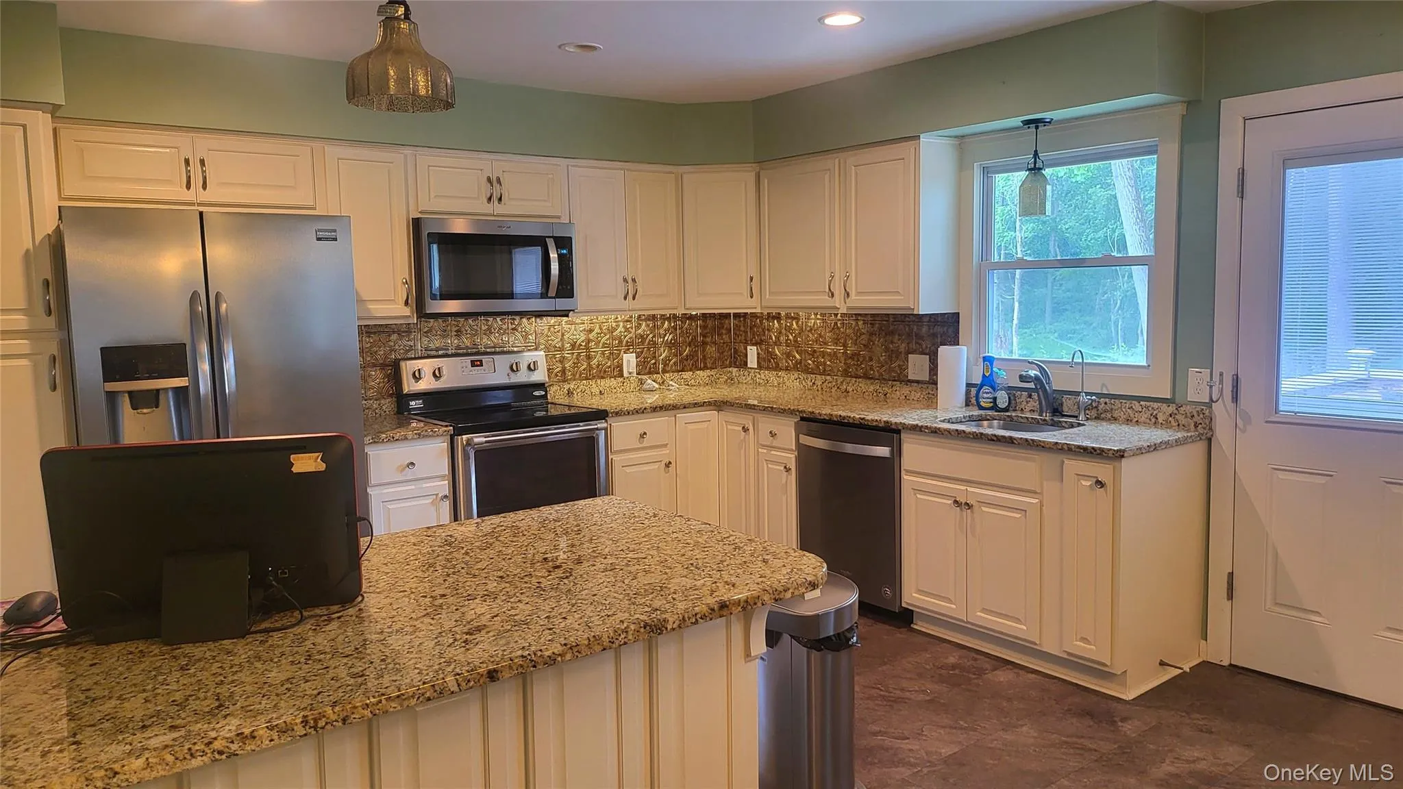 Kitchen featuring stone counters, and recessed lighting Kitchen featuring stone counters, and recessed lighting