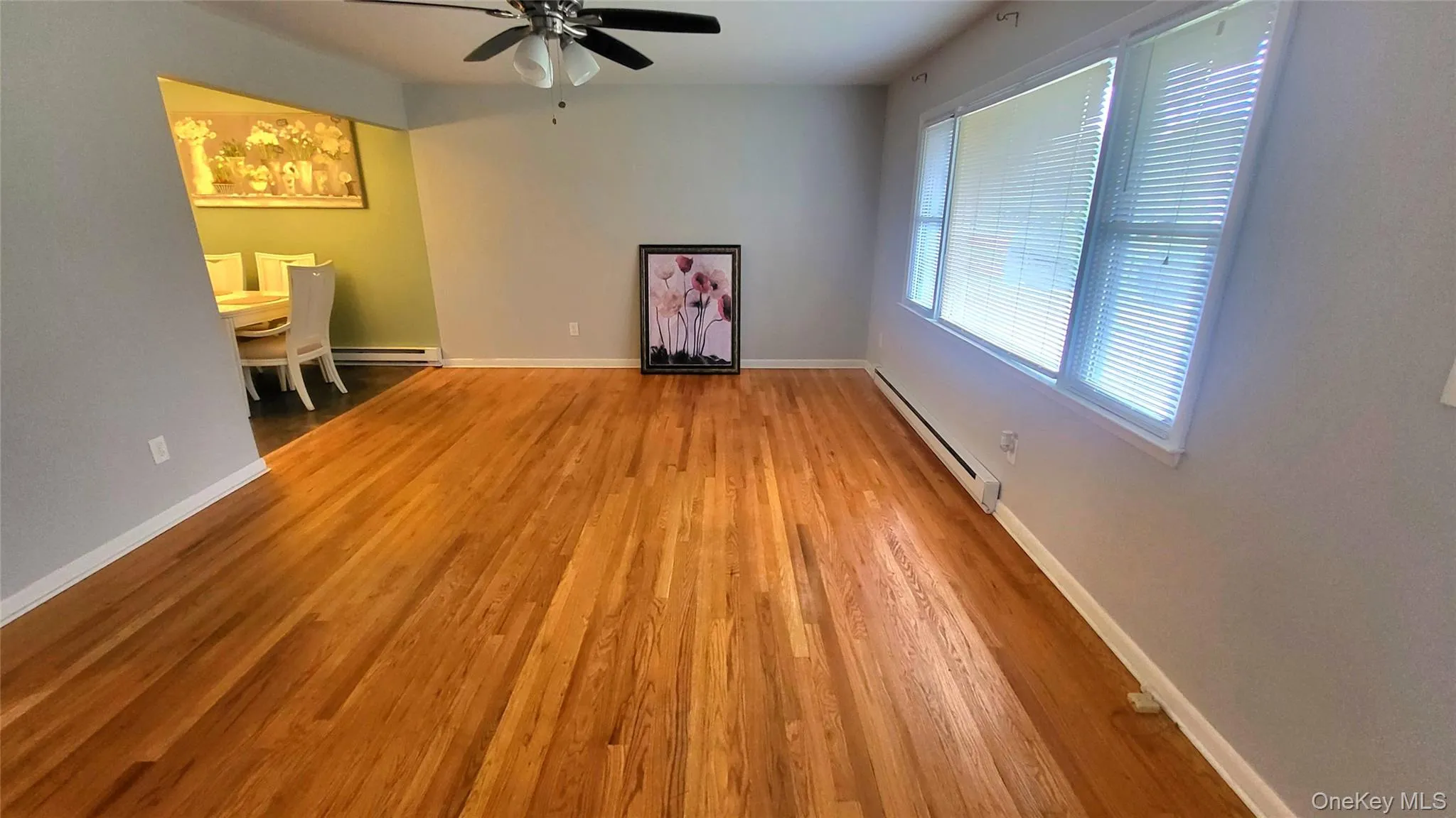Unfurnished living with hardwood floors Unfurnished living with hardwood floors
