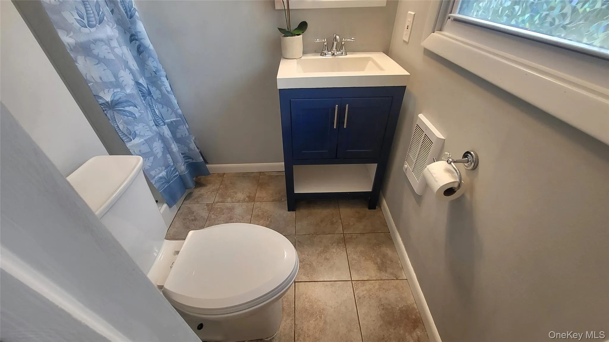 Primary bathroom with shower and shower curtain Primary bathroom with shower and shower curtain