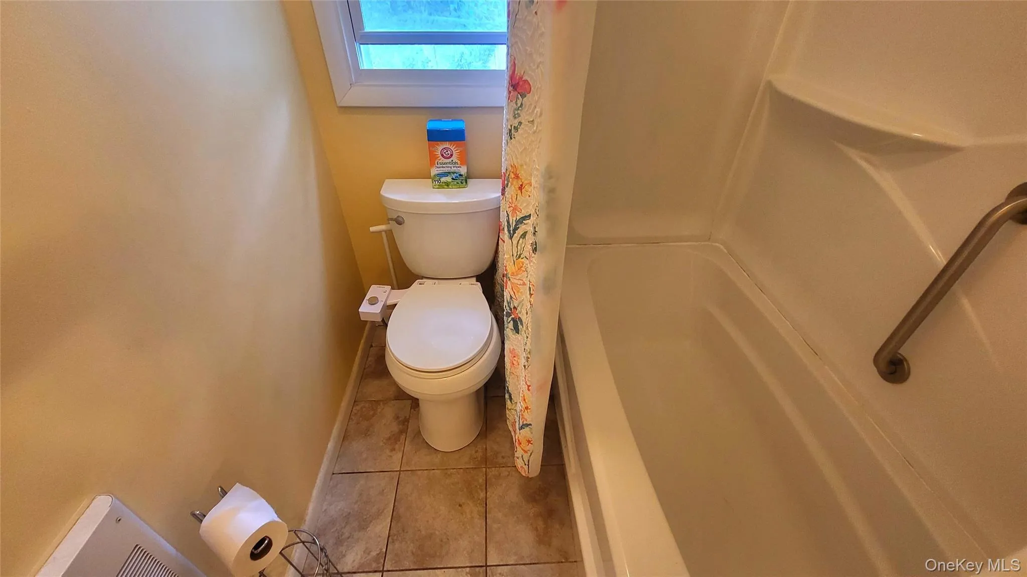 Hallway bath featuring shower / tub combo Hallway bath featuring shower / tub combo
