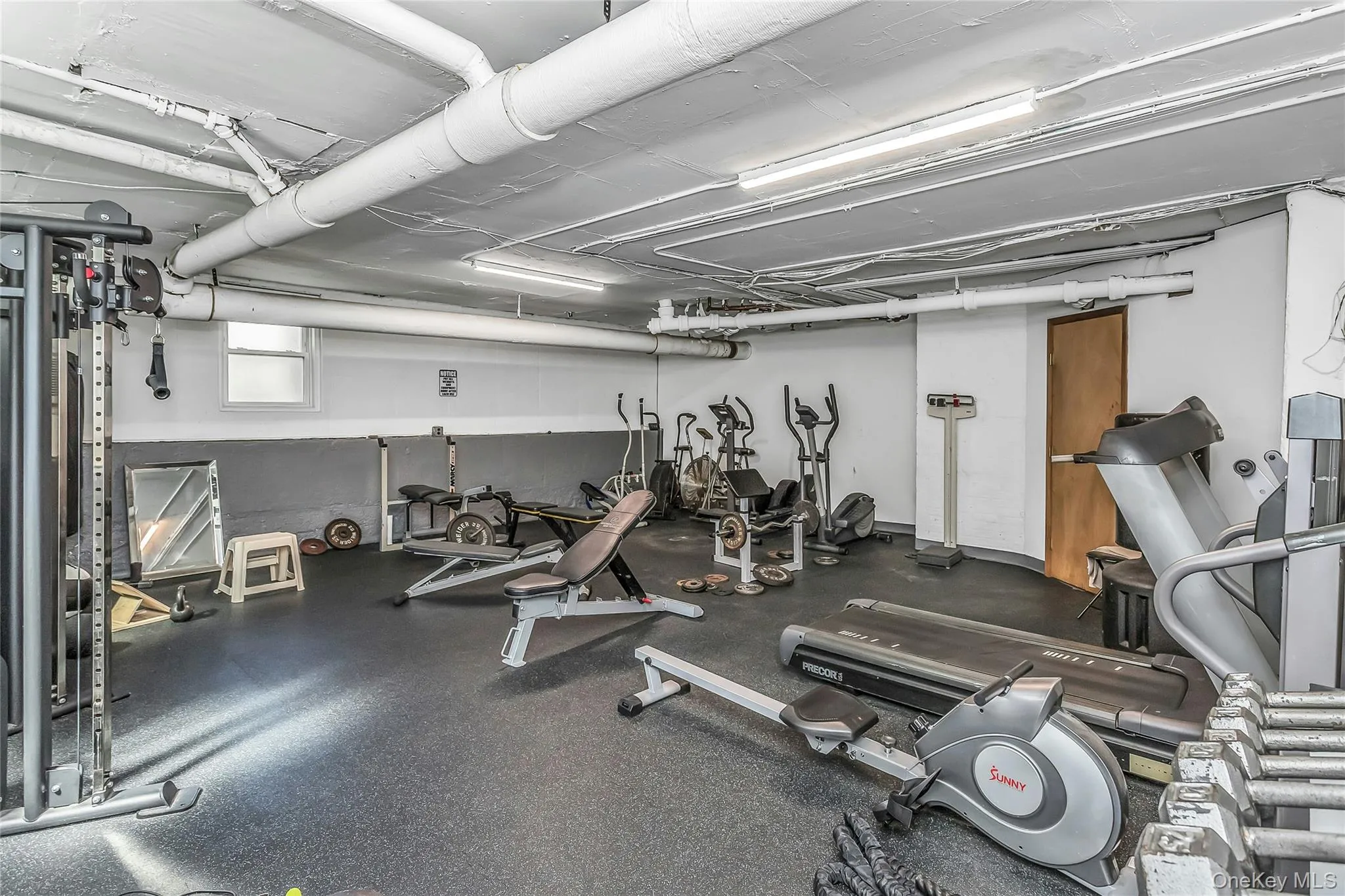 Gym located just one level below with treadmill, weights, and elliptical Gym located just one level below with treadmill, weights, and elliptical