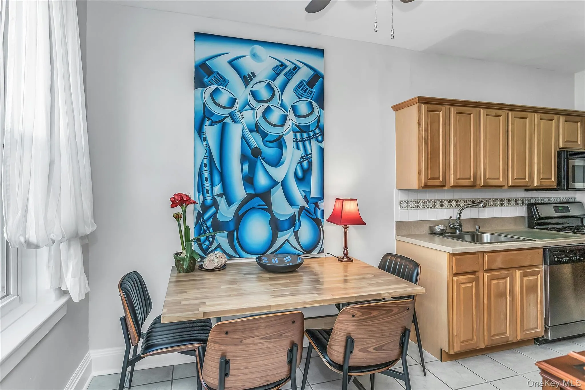 Bright and airy Eat-In Kitchen with plenty of sunlight and stainless steel appliances Bright and airy Eat-In Kitchen with plenty of sunlight and stainless steel appliances