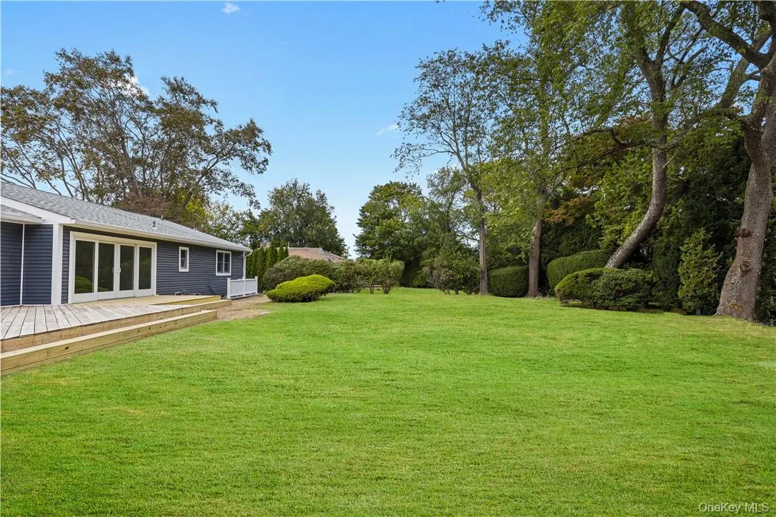 View of yard featuring a deck, plenty of yard space View of yard featuring a deck, plenty of yard space