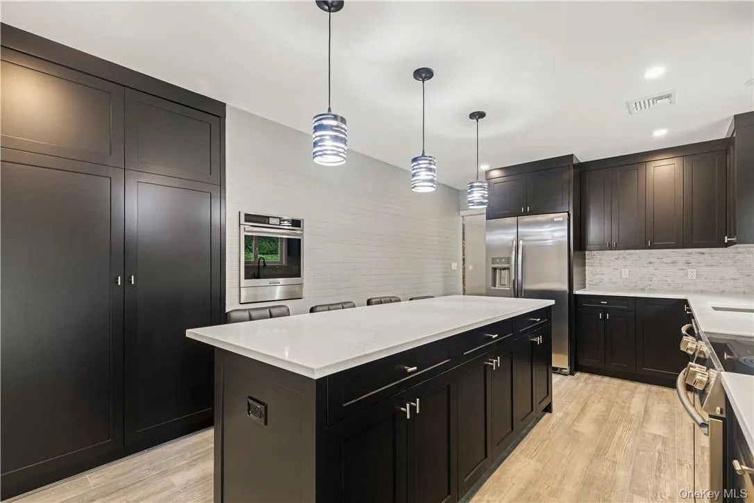 Kitchen featuring stainless steel appliances, large pantry and wall oven Kitchen featuring stainless steel appliances, large pantry and wall oven