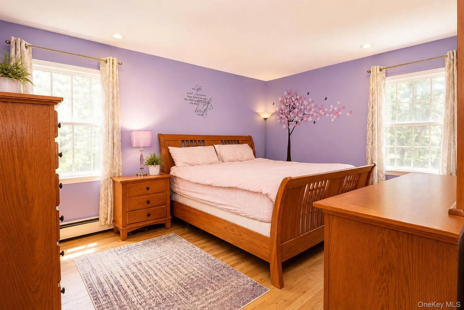 Hardwood Floors in Primary Bedroom, lots of natural light Hardwood Floors in Primary Bedroom, lots of natural light