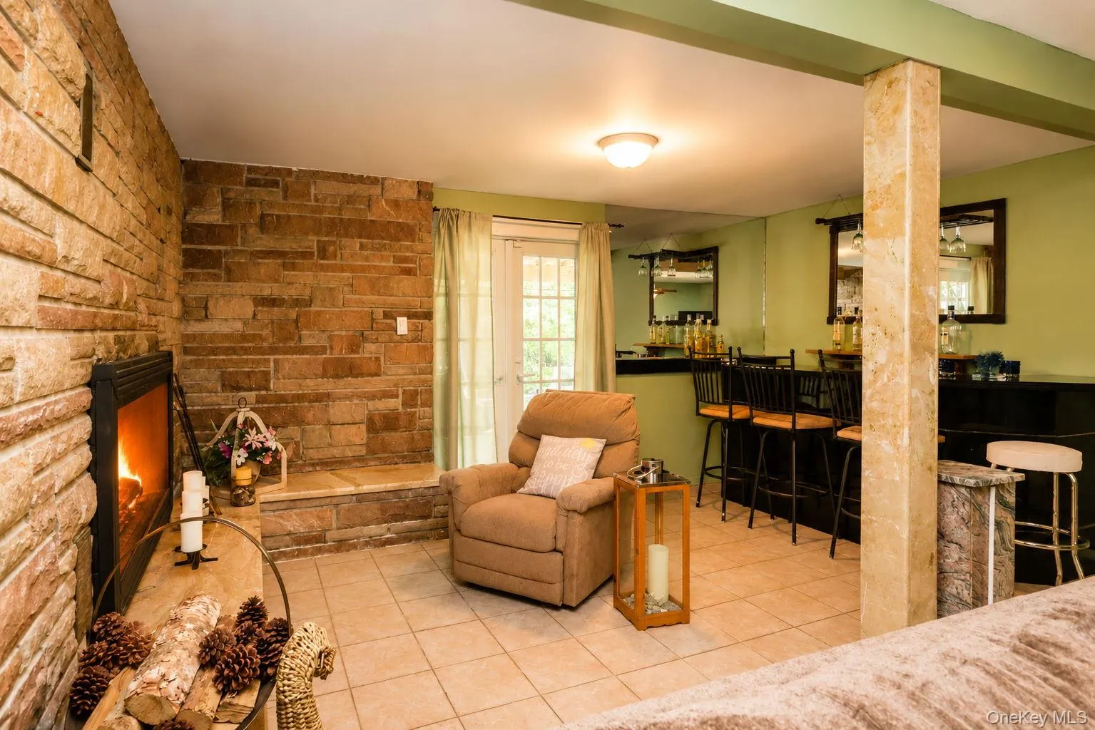 Lower Level Family Room with tile floor, fireplace and bar. Lower Level Family Room with tile floor, fireplace and bar.