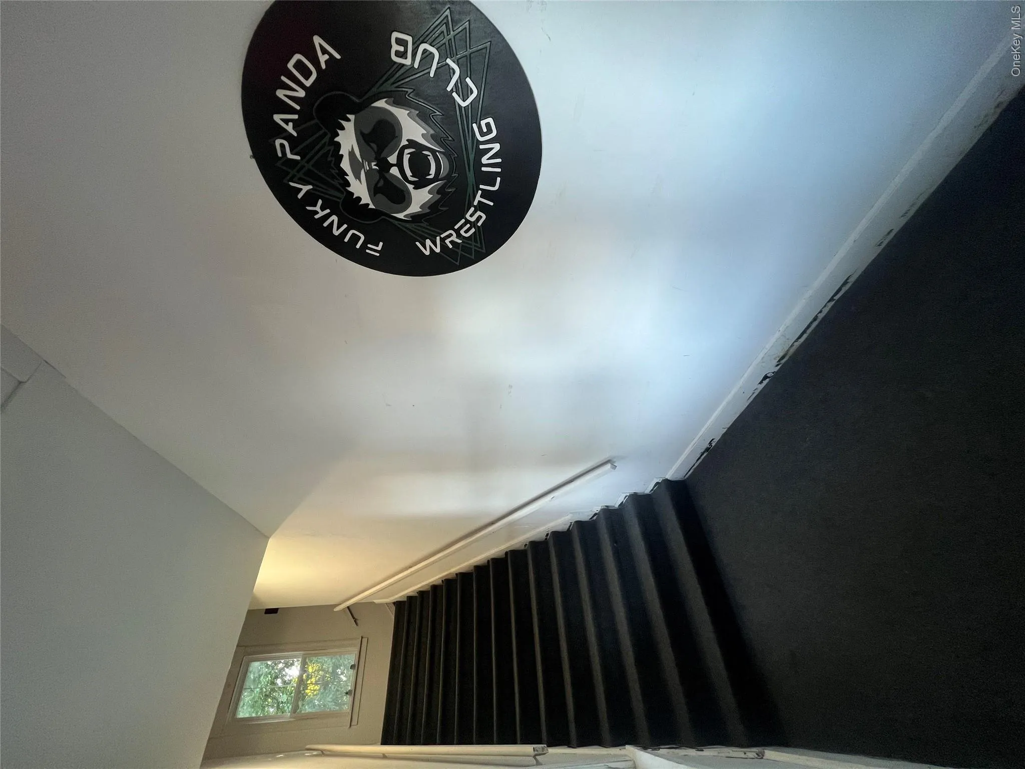 Stairway featuring baseboards Stairway featuring baseboards