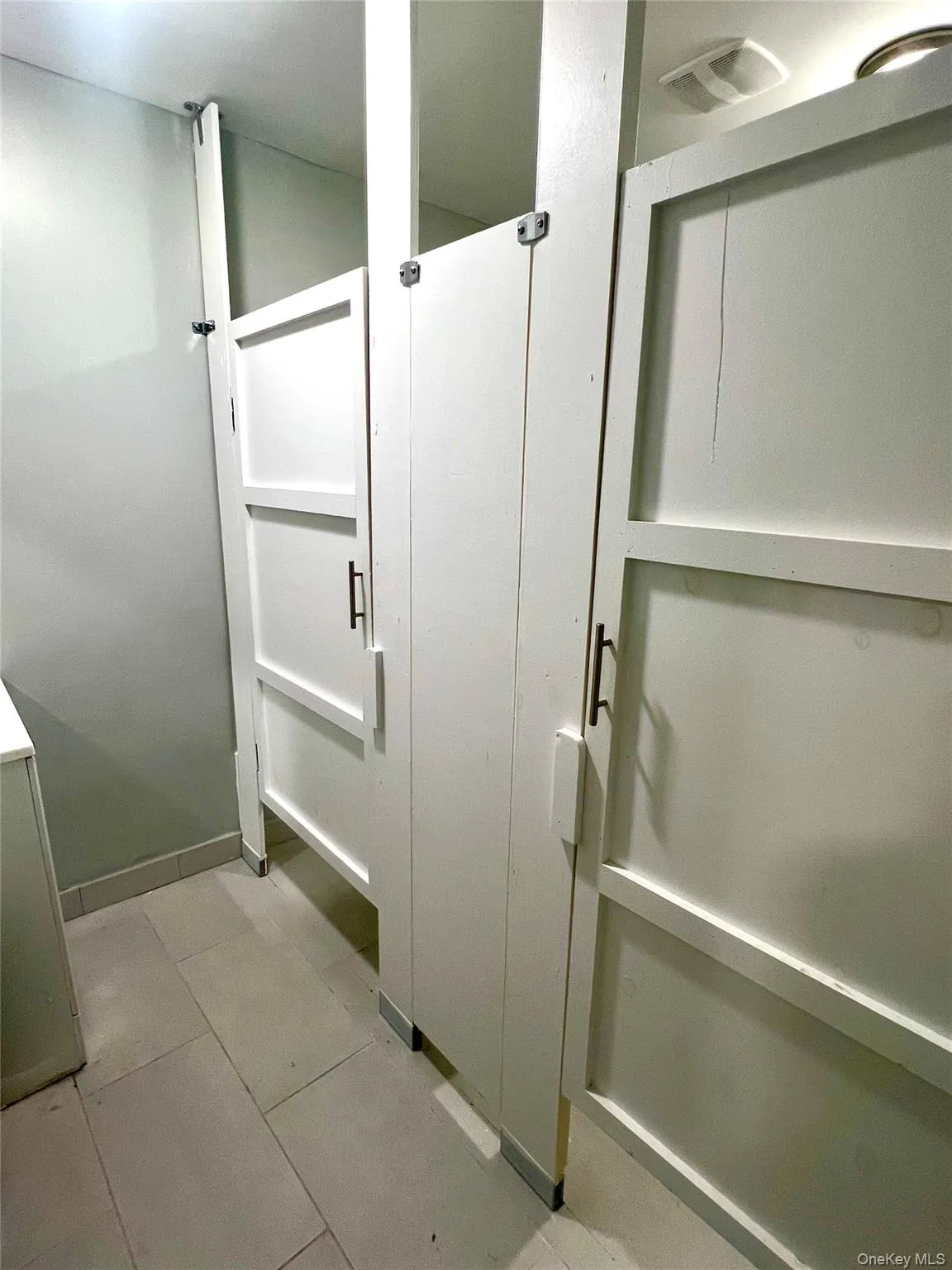 Bathroom featuring light tile patterned flooring Bathroom featuring light tile patterned flooring