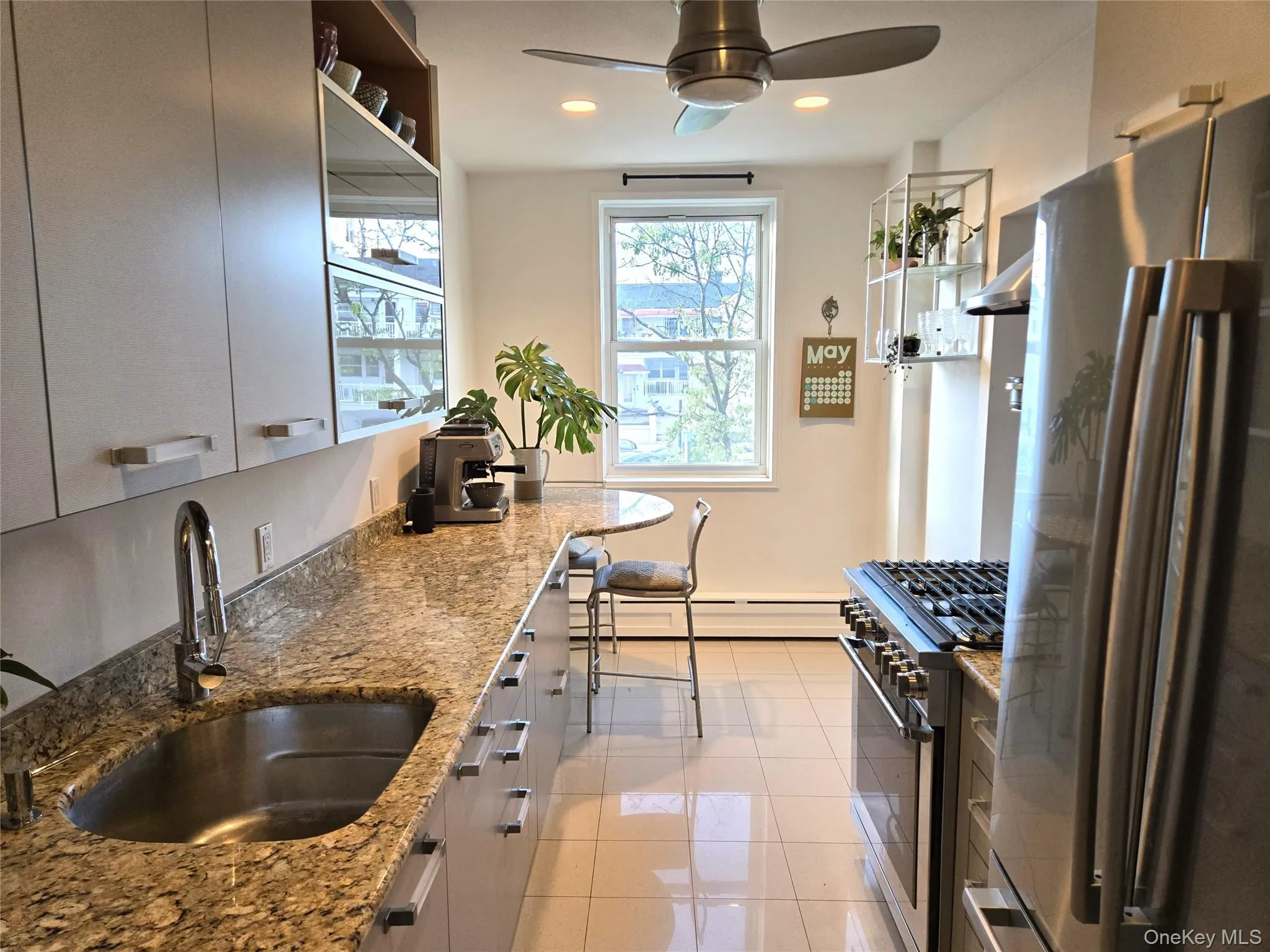 Kitchen with granite counters and stainless appliances Kitchen with granite counters and stainless appliances