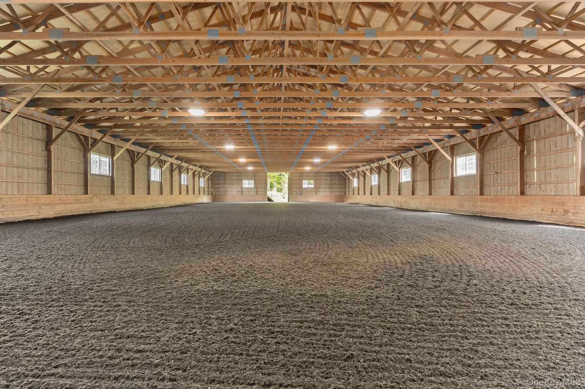 72x160 indoor riding ring connected to the barn with new footing, a new roof and new LED lighting 72x160 indoor riding ring connected to the barn with new footing, a new roof and new LED lighting
