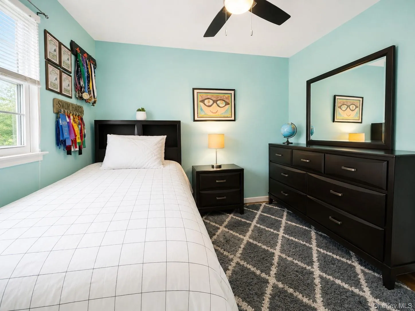 Another look at this inviting third bedroom, complete with a ceiling fan and light combination for year-round comfort. Another look at this inviting third bedroom, complete with a ceiling fan and light combination for year-round comfort.
