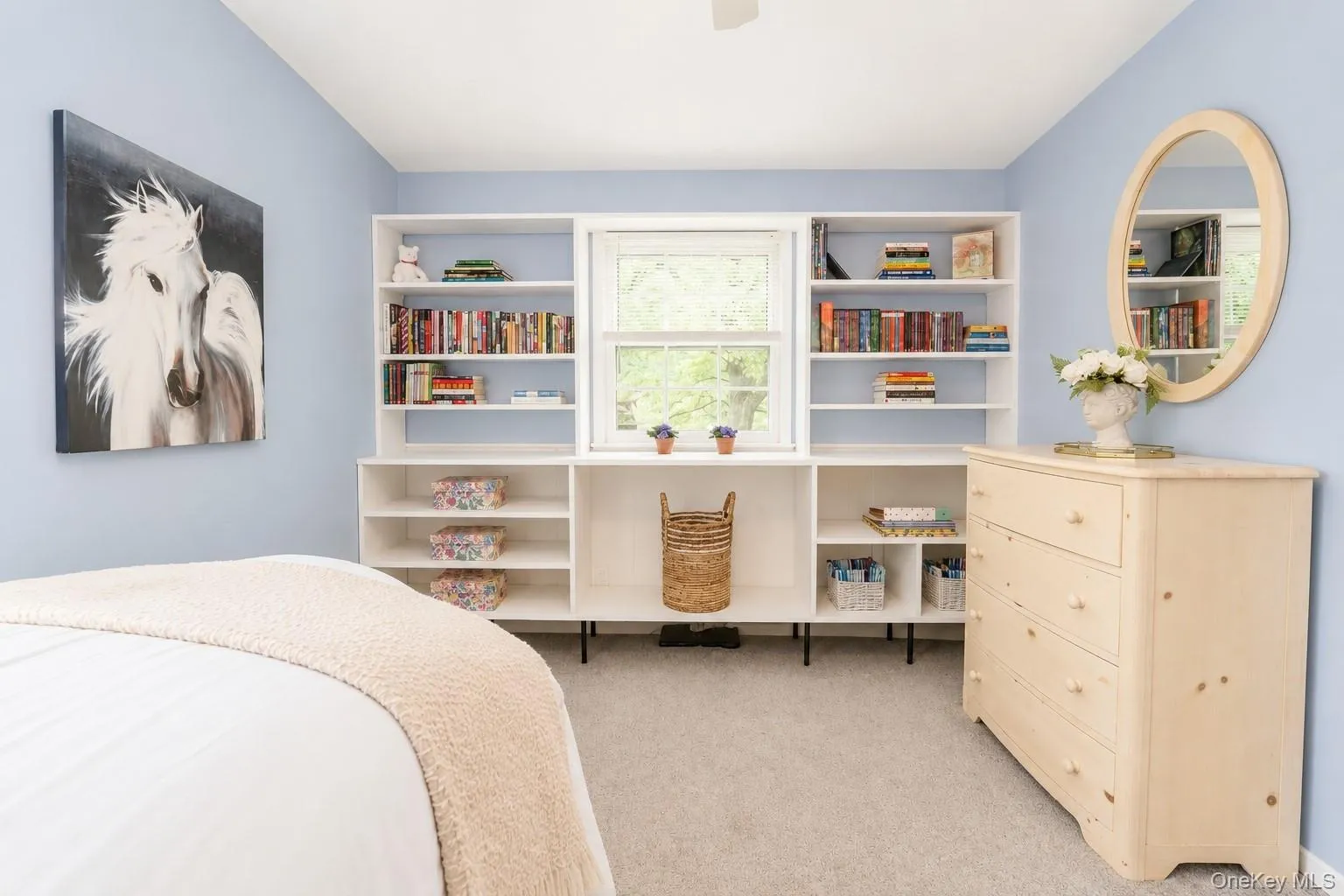 This secondary bedroom is highlighted by a wall of built-in bookshelves, offering both charm and functionality. This secondary bedroom is highlighted by a wall of built-in bookshelves, offering both charm and functionality.