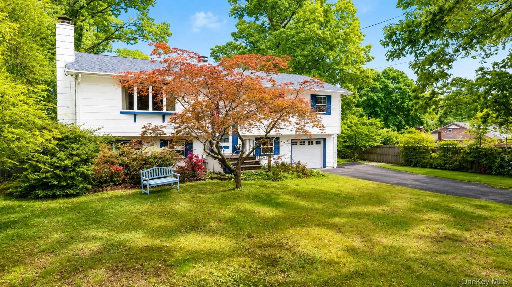 Enjoy beautiful curb appeal with a generous front lawn, mature lush greenery, and plenty of driveway parking for everyday convenience and entertaining. Enjoy beautiful curb appeal with a generous front lawn, mature lush greenery, and plenty of driveway parking for everyday convenience and entertaining.