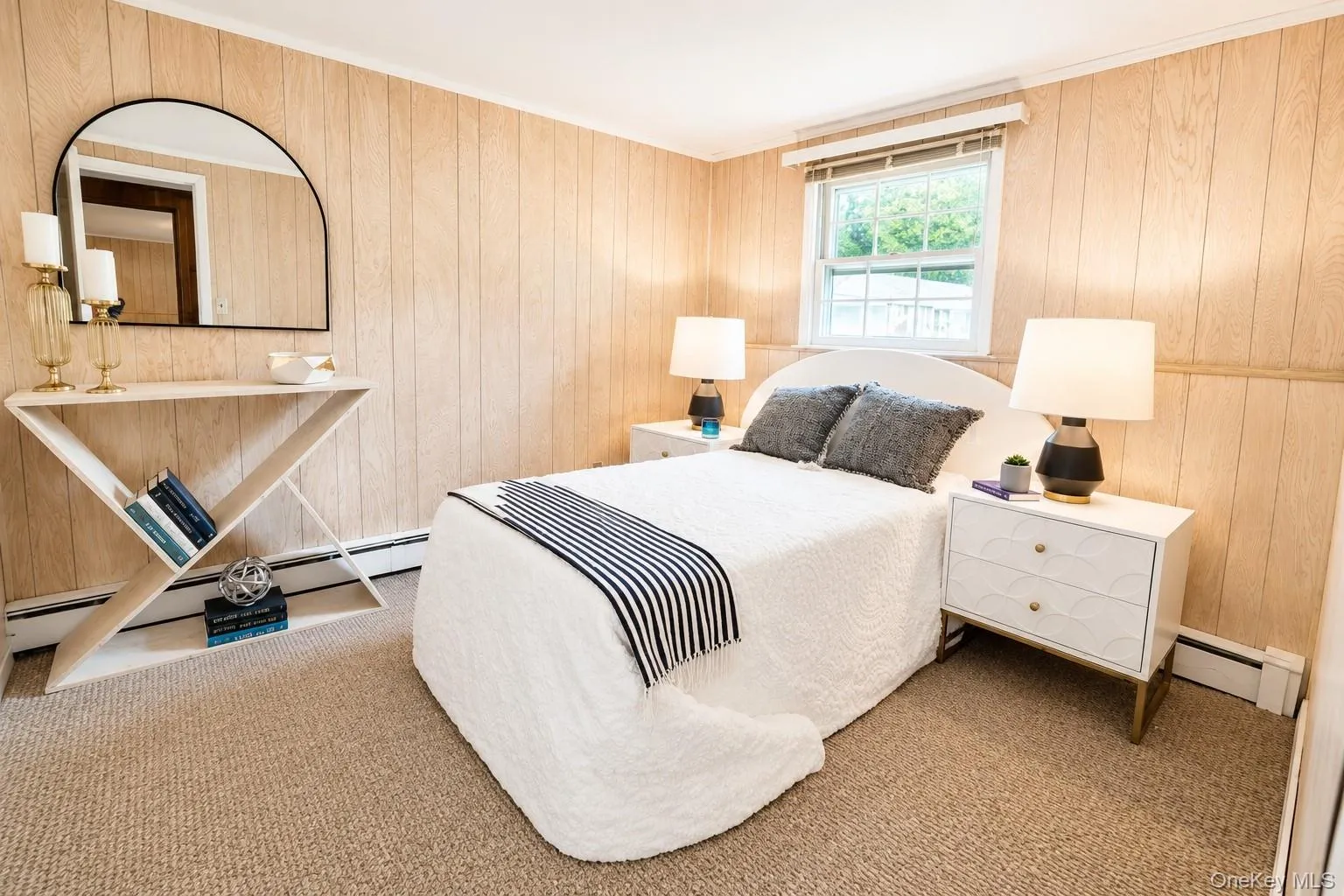 Lower-level bedroom with new carpeting, providing a flexible and comfortable space suited for a guest suite or private office. Lower-level bedroom with new carpeting, providing a flexible and comfortable space suited for a guest suite or private office.