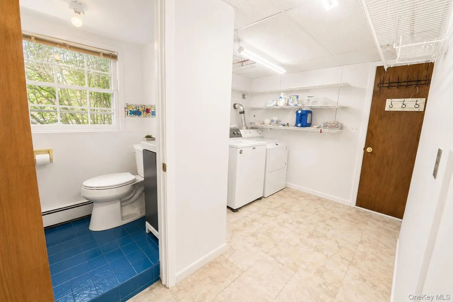Lower level includes a powder room and laundry area with ample storage and easy access to the garage. Lower level includes a powder room and laundry area with ample storage and easy access to the garage.