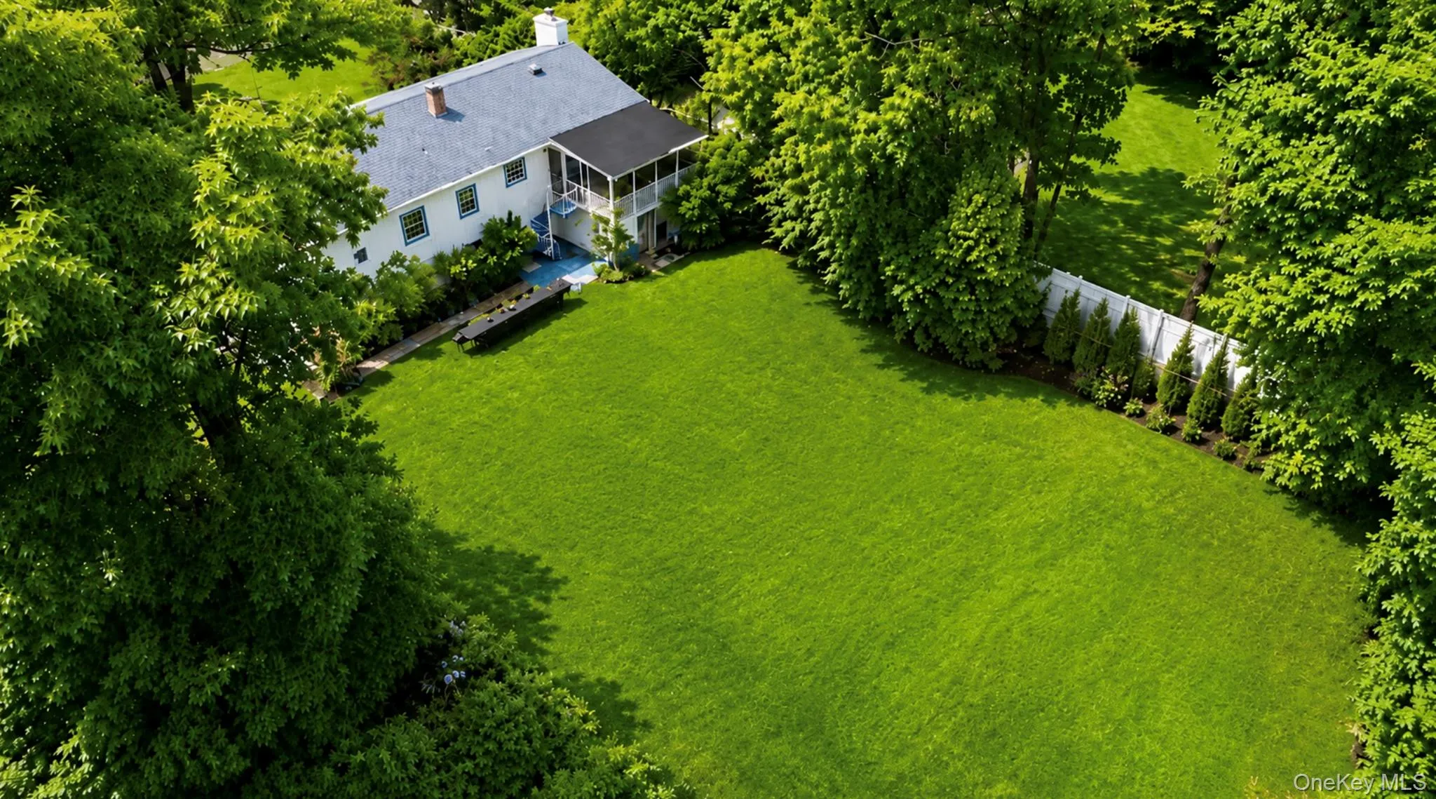A digitally staged backyard featuring a wide, open lawn—perfect for play, relaxation, and outdoor enjoyment. A digitally staged backyard featuring a wide, open lawn—perfect for play, relaxation, and outdoor enjoyment.