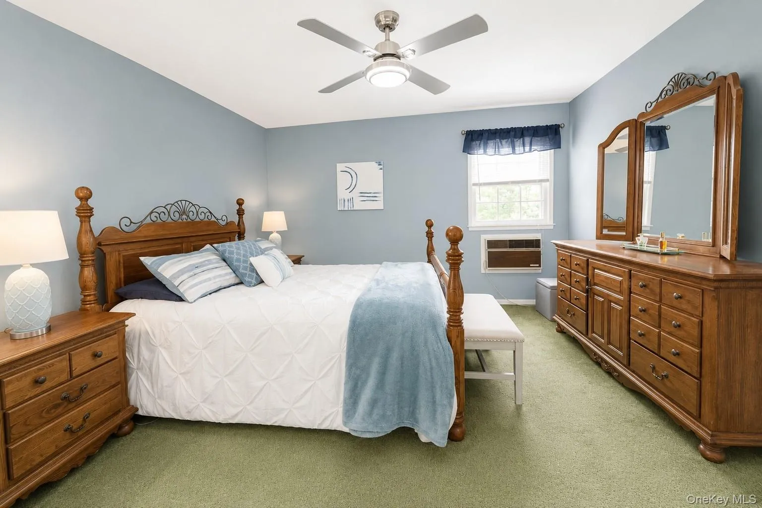 Generously sized primary bedroom featuring carpeted flooring, with the added bonus of beautiful hardwood floors underneath. Generously sized primary bedroom featuring carpeted flooring, with the added bonus of beautiful hardwood floors underneath.