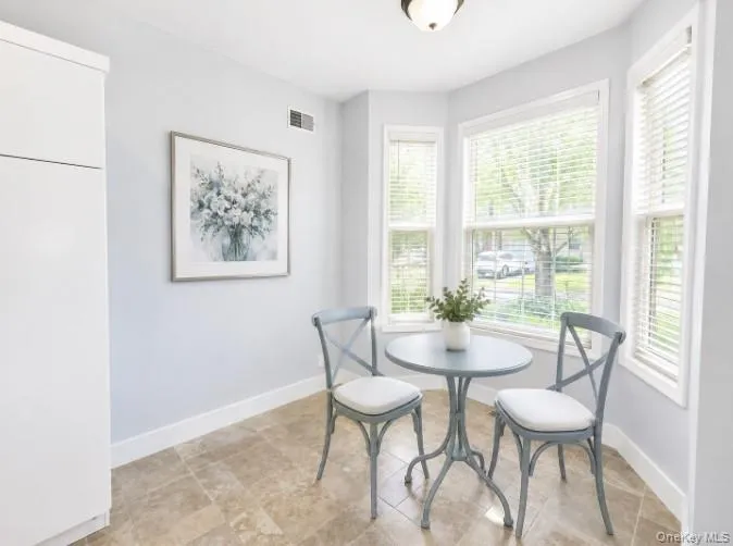 bright and cheery eat in area...table and chairs digitally added bright and cheery eat in area...table and chairs digitally added