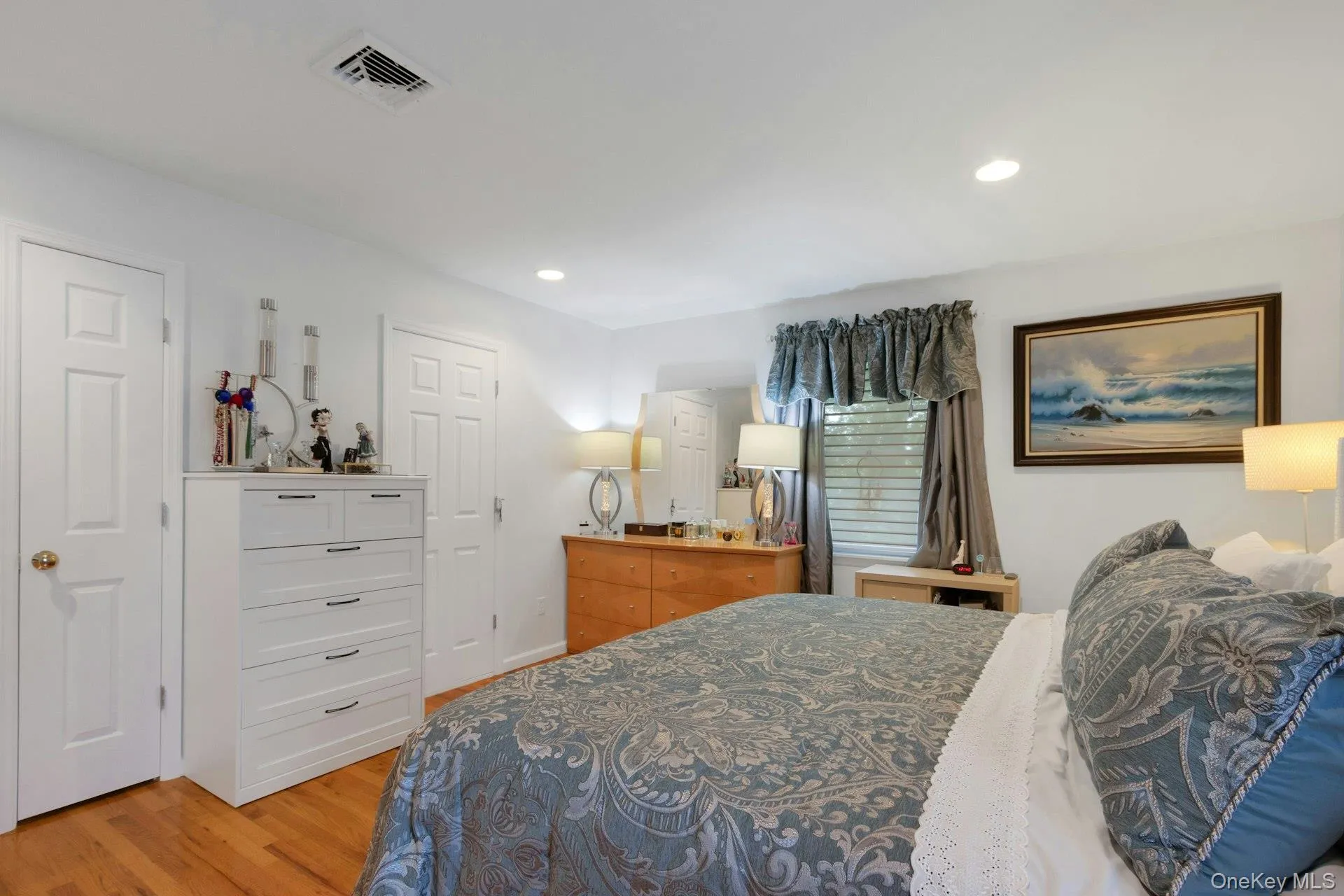 Primary bedroom with doors to ensuite bath and walk in closet Primary bedroom with doors to ensuite bath and walk in closet