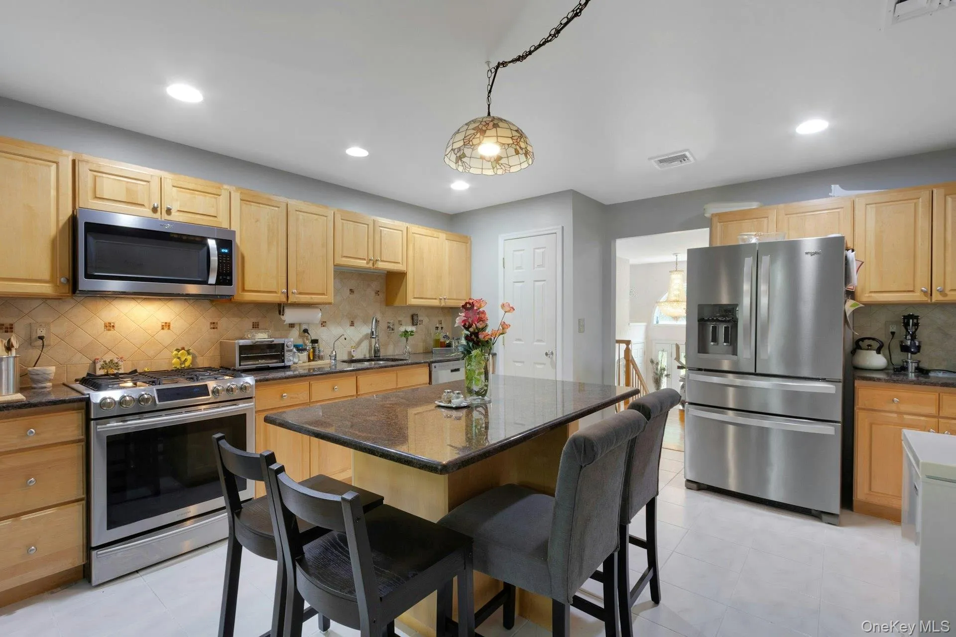 Kitchen with stainless appliances and center island Kitchen with stainless appliances and center island