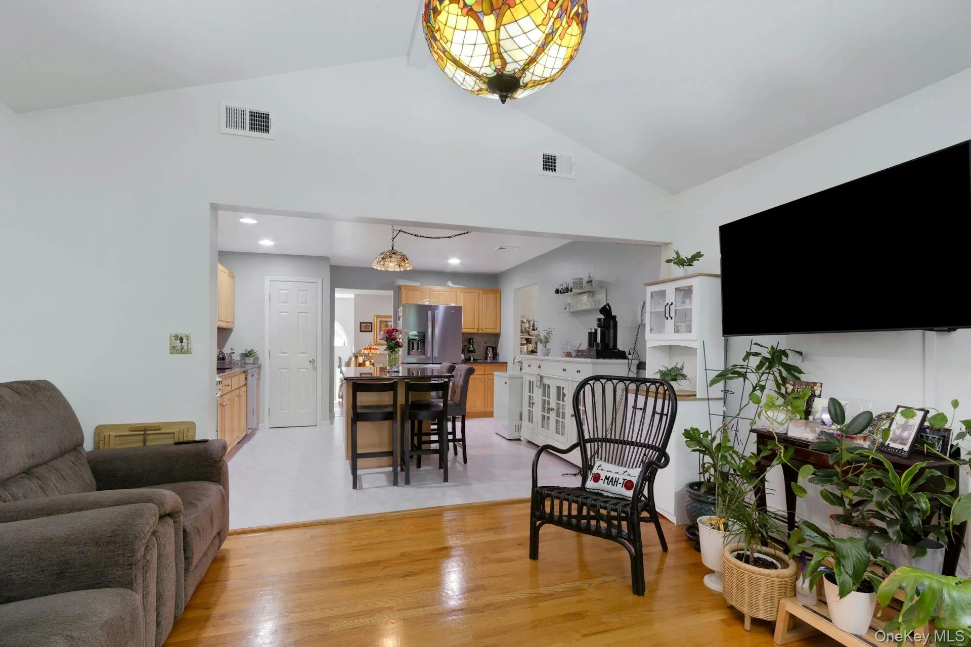 Family room with hardwood floors open layout to kitchen Family room with hardwood floors open layout to kitchen