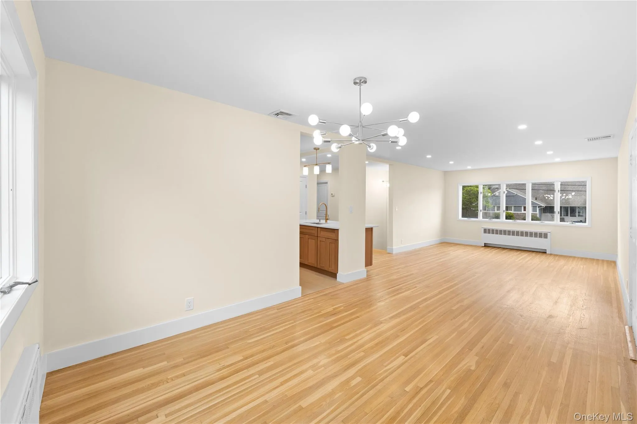 FORMAL LIVING ROOM OPEN TO THE DINING ROOM AND KITCHEN FORMAL LIVING ROOM OPEN TO THE DINING ROOM AND KITCHEN