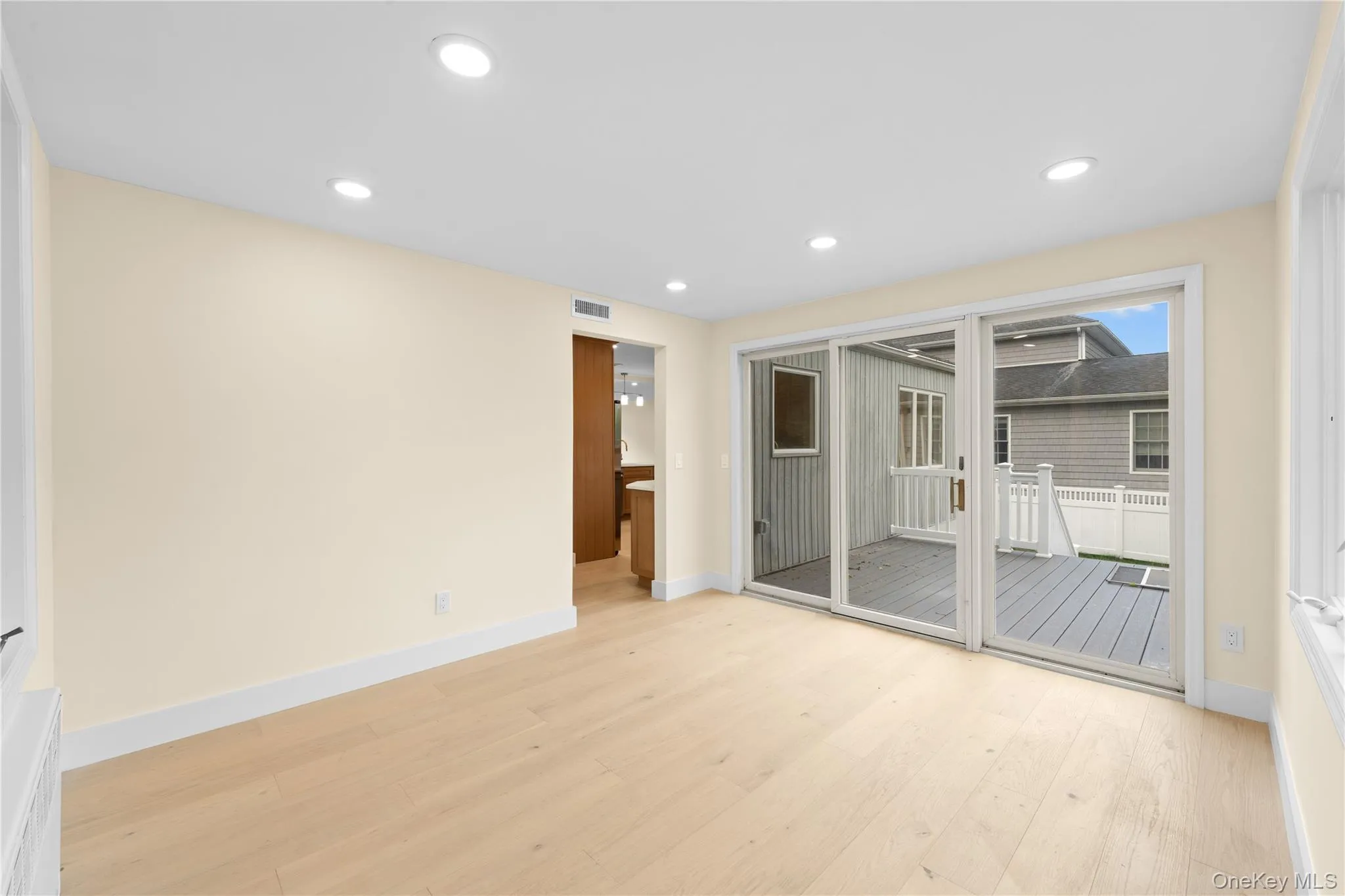 DEN WITH SLIDING GLASS DOORS TO THE BACKYARD DEN WITH SLIDING GLASS DOORS TO THE BACKYARD
