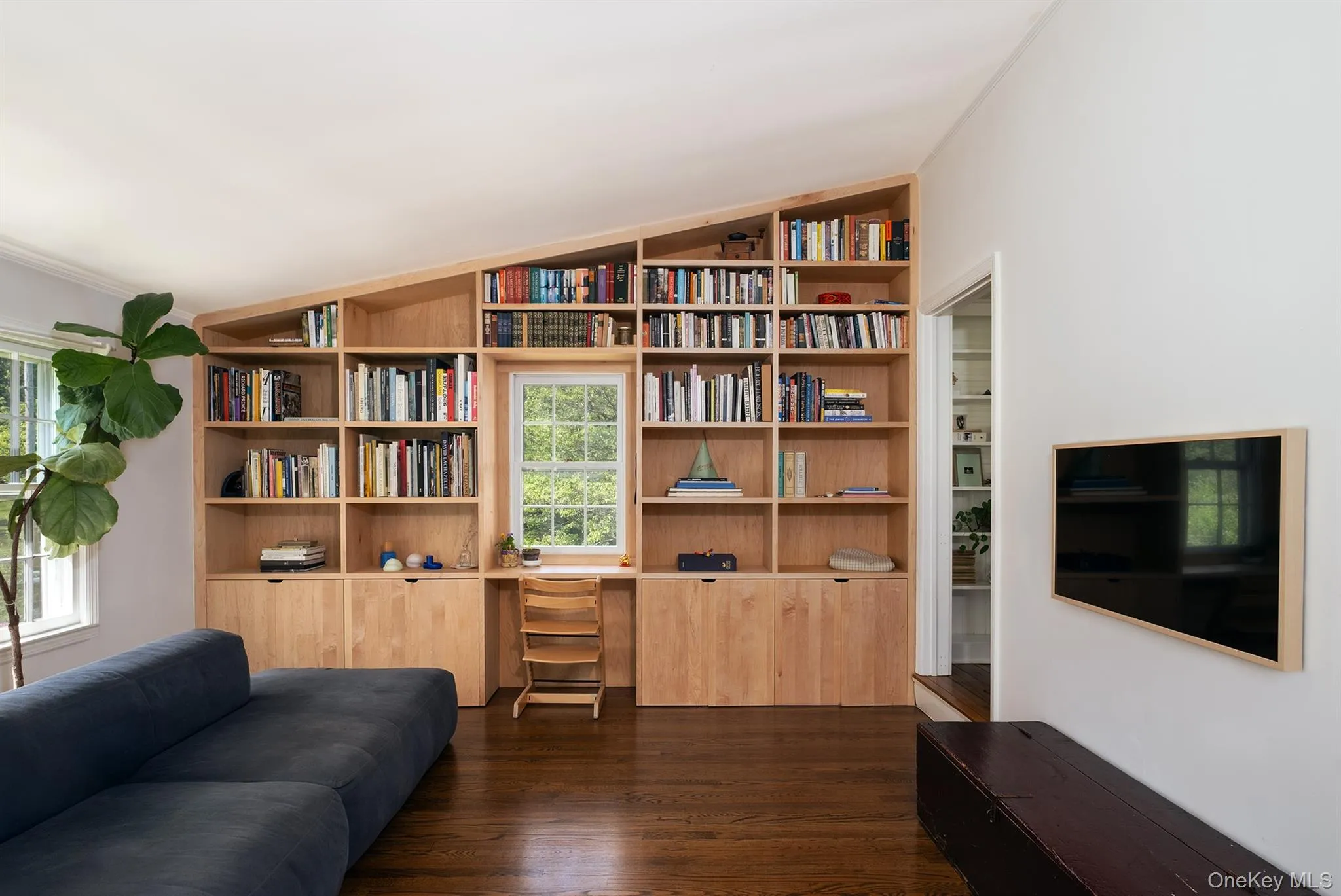 Media room/den with built-in bookshelves Media room/den with built-in bookshelves