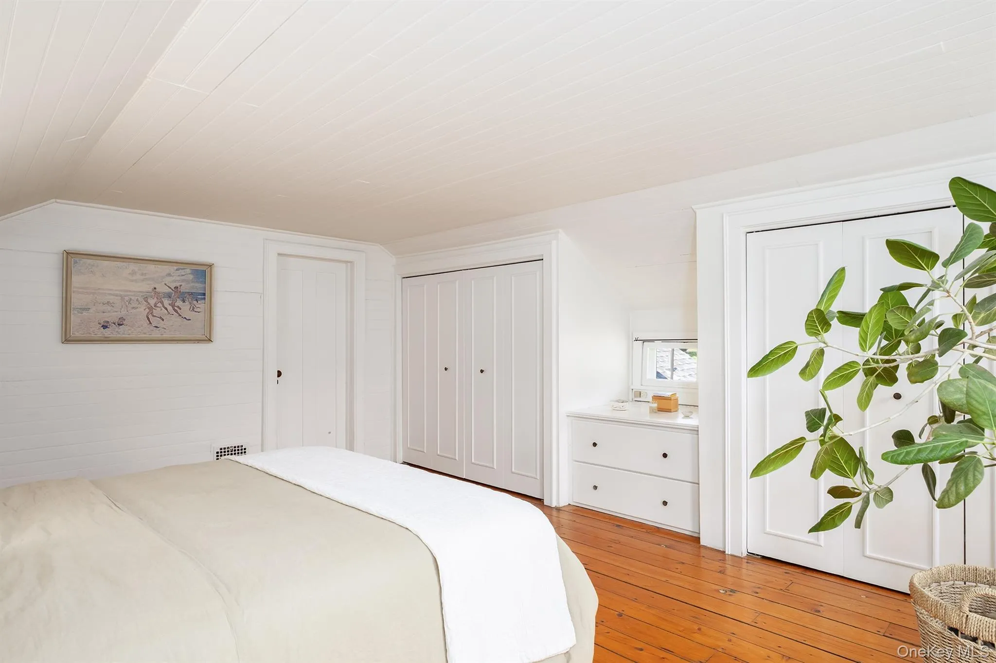 Primary bedroom featuring large closets Primary bedroom featuring large closets