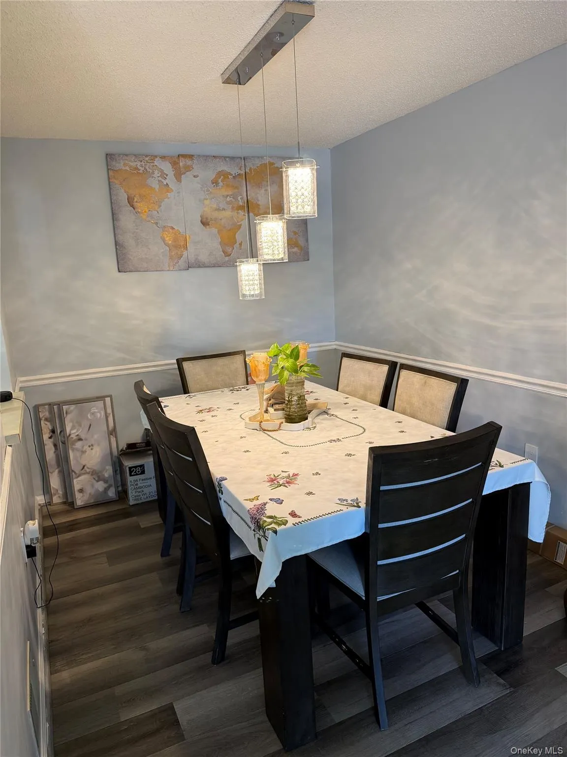 Recessed ceiling with a linear pendant light fixture featuring three textured glass shades Recessed ceiling with a linear pendant light fixture featuring three textured glass shades