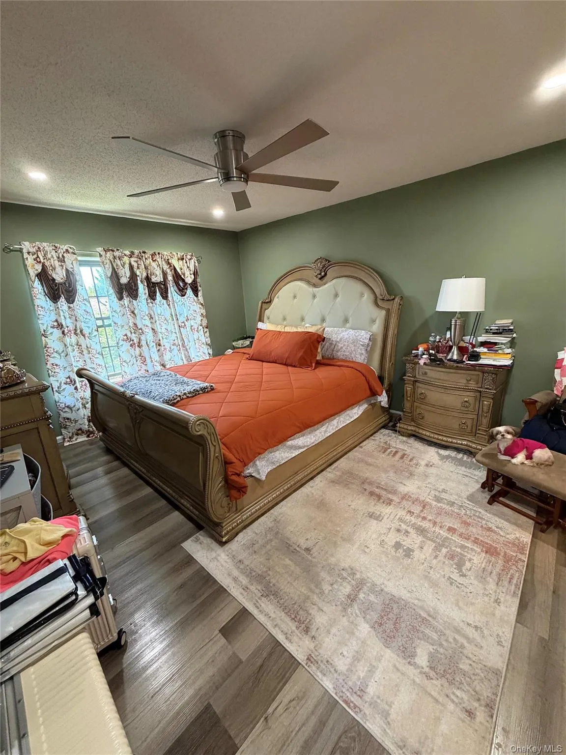 Bedroom featuring wood-finish flooring, recessed lighting, and a modern ceiling fan Bedroom featuring wood-finish flooring, recessed lighting, and a modern ceiling fan