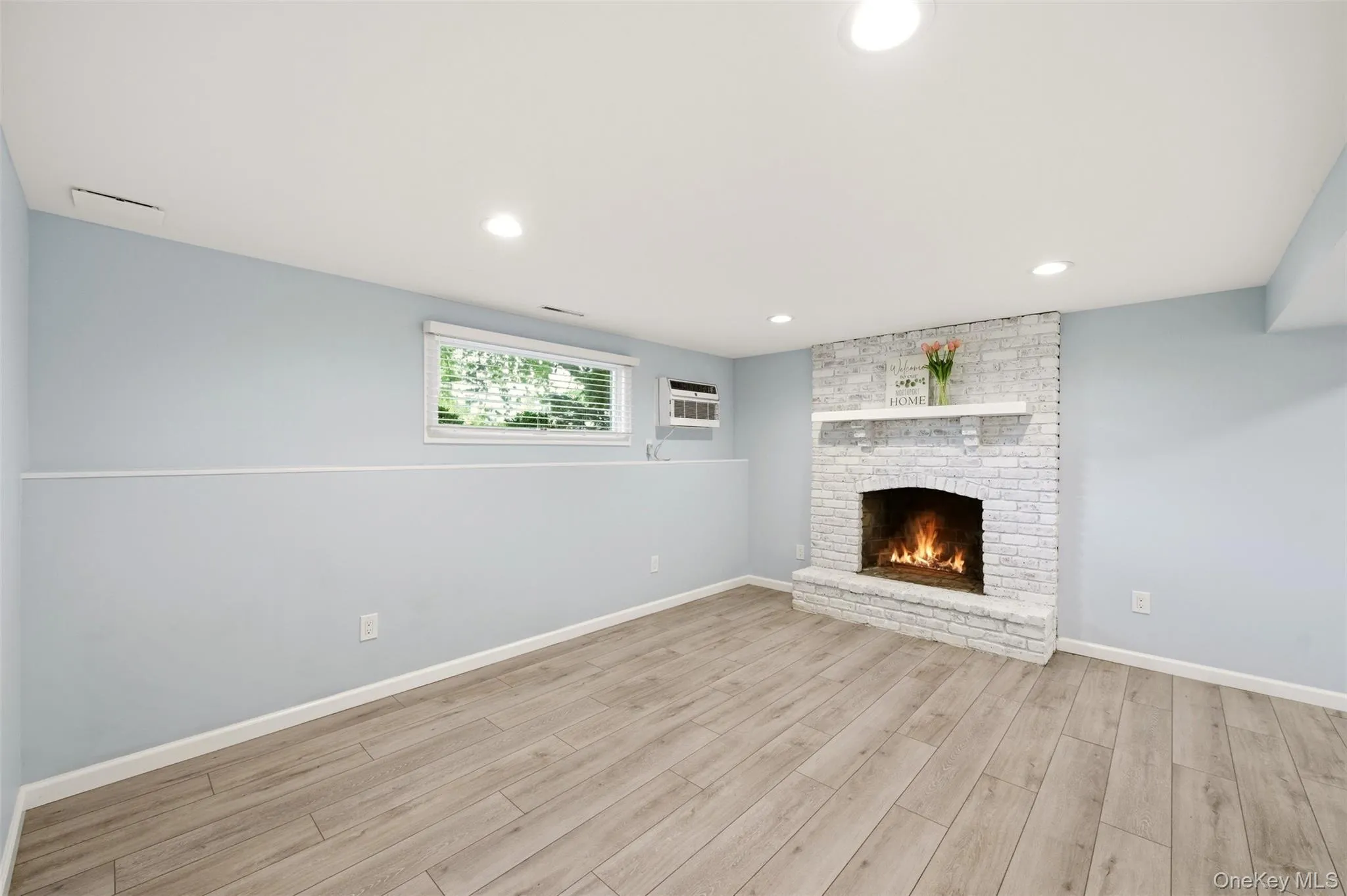 Lower level living room, wood burning fireplace Lower level living room, wood burning fireplace