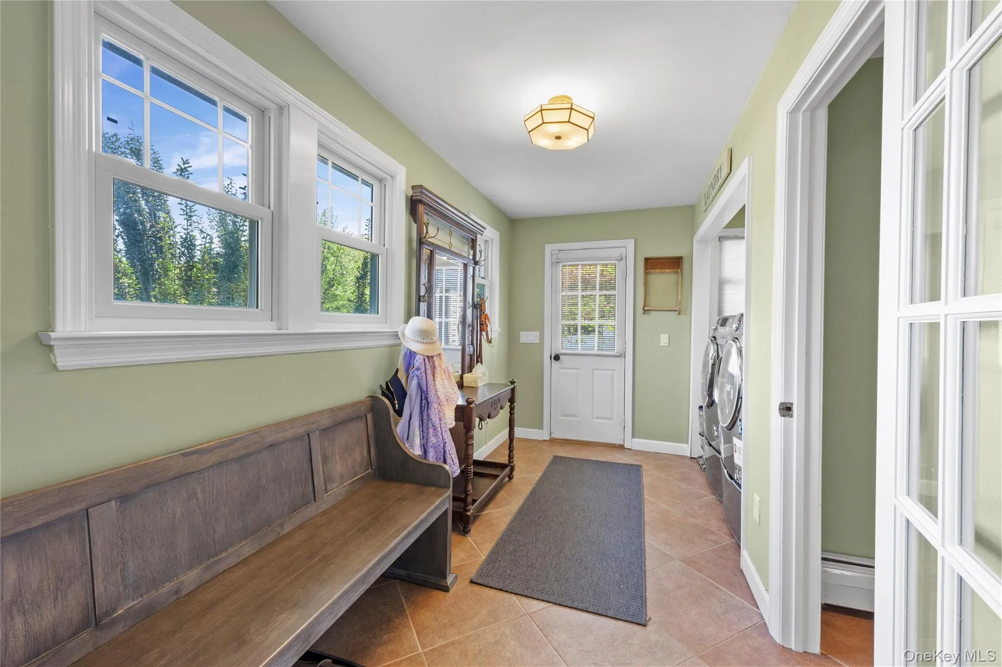 Mudroom with separate entry, laundry and full bath Mudroom with separate entry, laundry and full bath