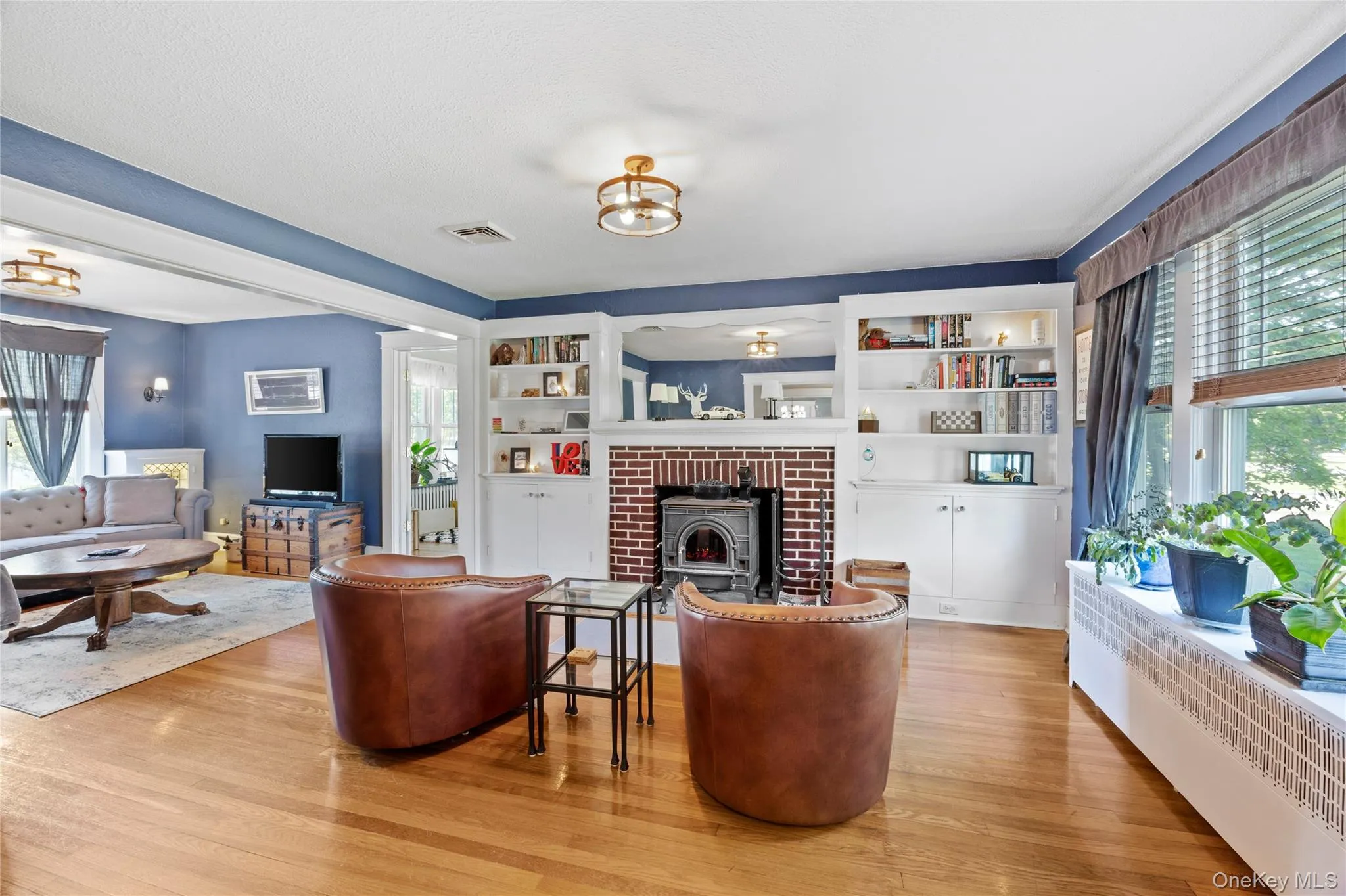 Living room featuring a wood burning stove Living room featuring a wood burning stove