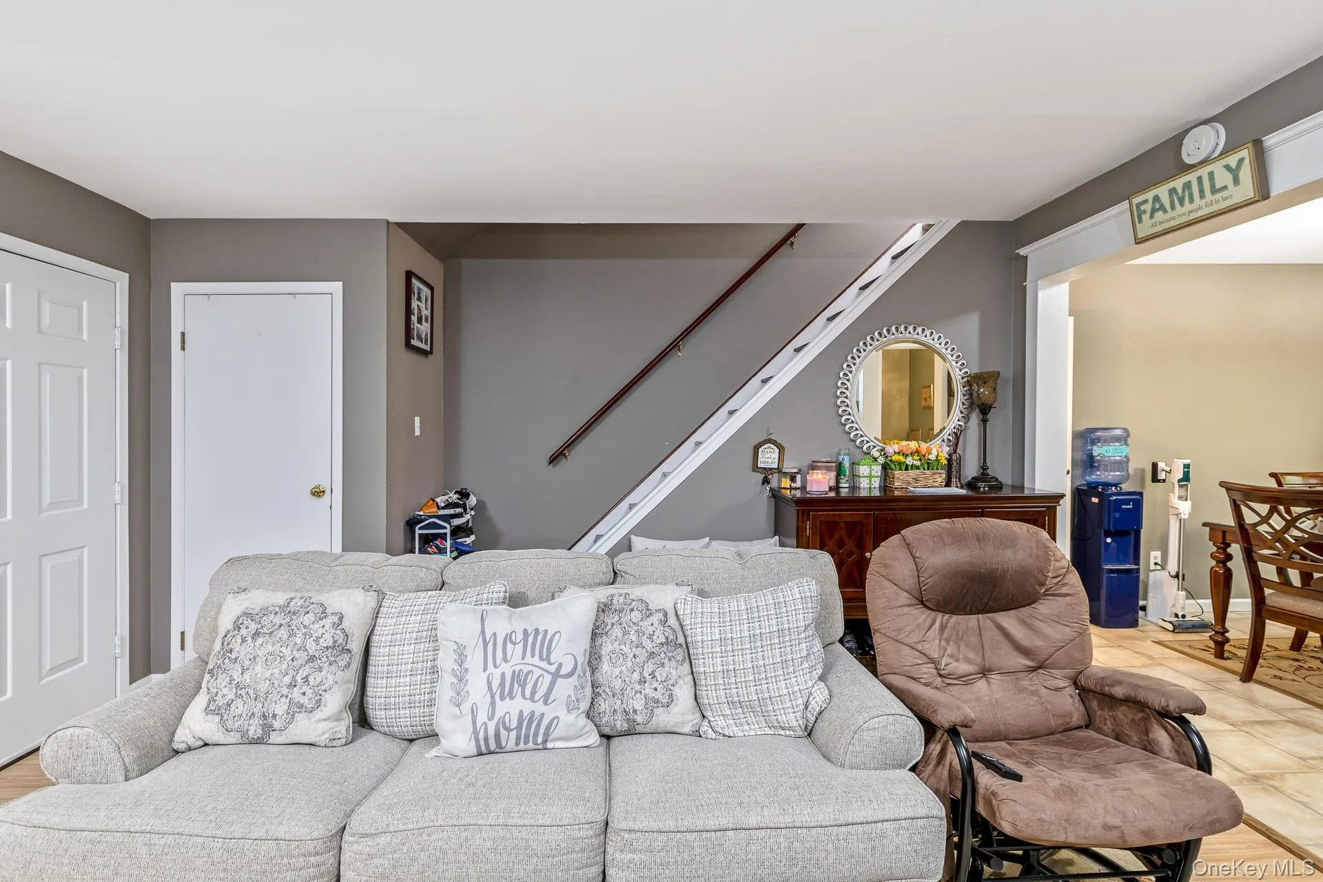 Living area with neutral gray walls and white trim Living area with neutral gray walls and white trim