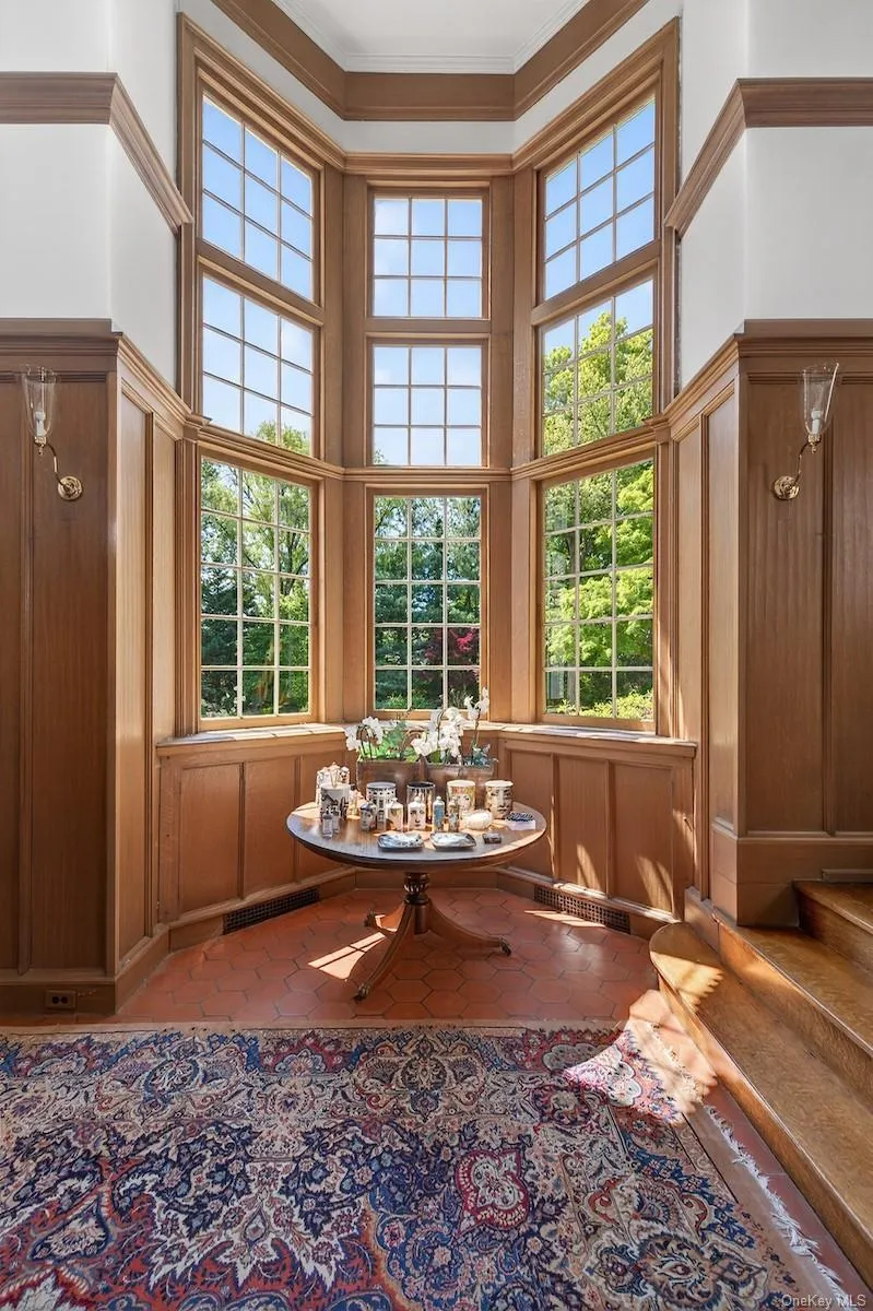 Triple-height bay window in the entry stair hall Triple-height bay window in the entry stair hall