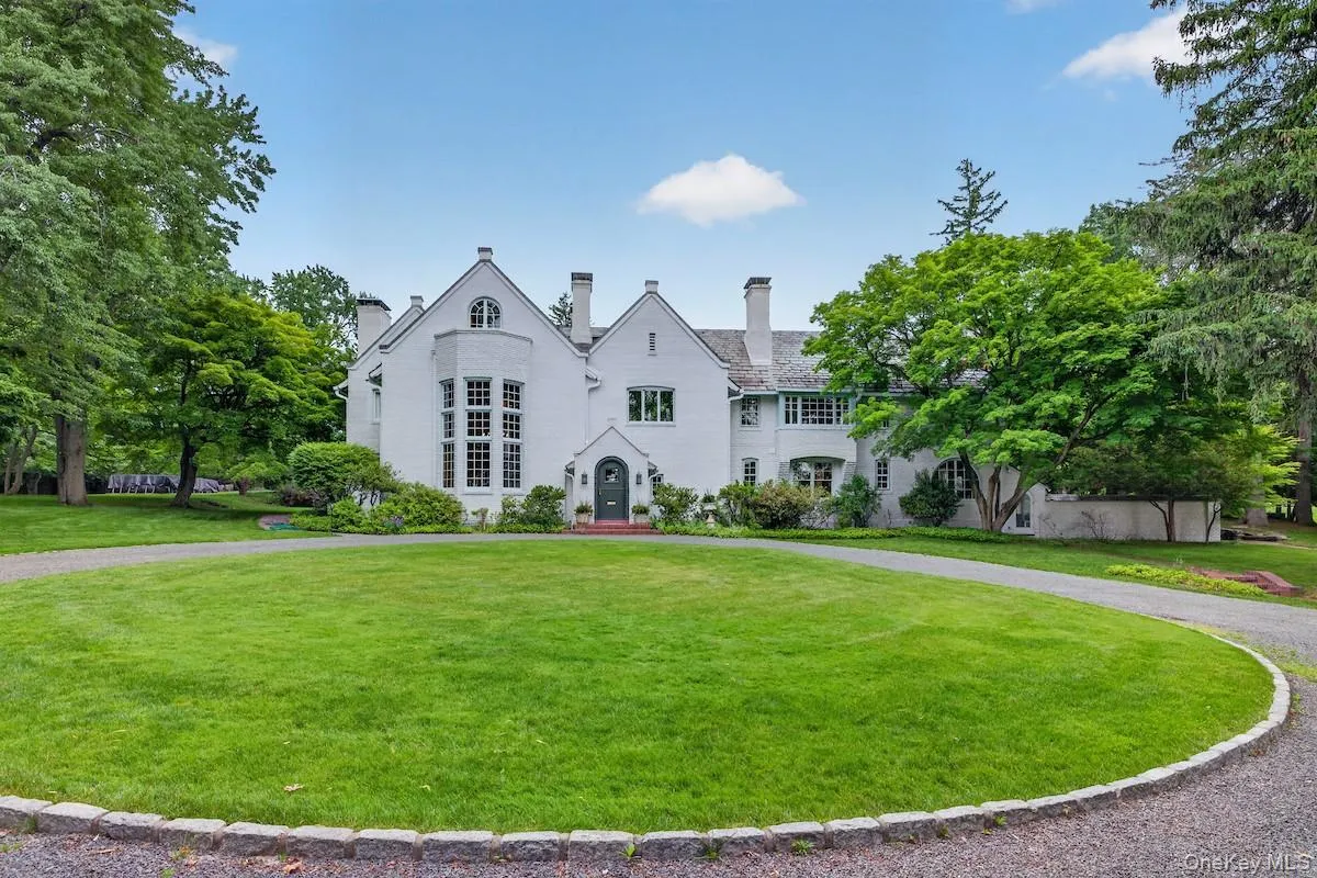 A graceful circular gravel drive enters the peaceful 1.7 acre property A graceful circular gravel drive enters the peaceful 1.7 acre property