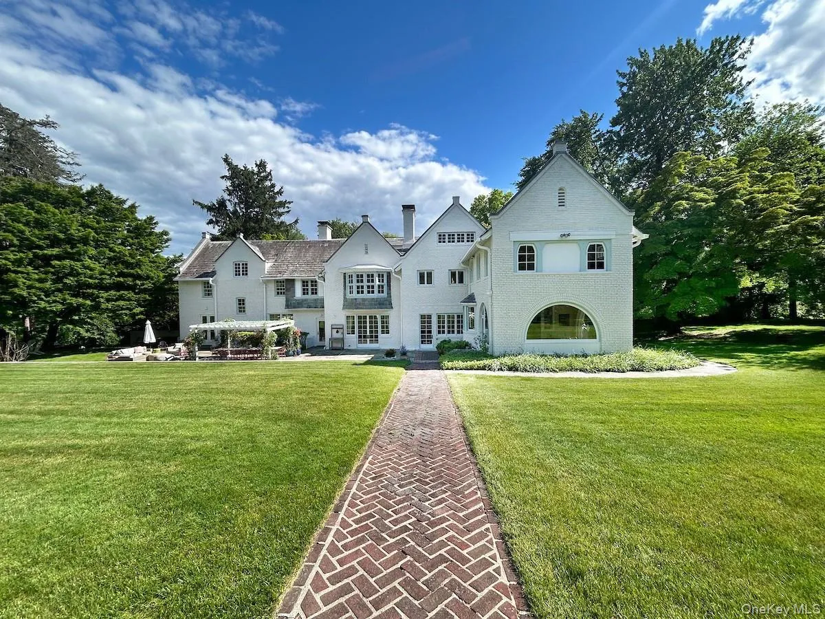 Constructed in 1915, 1 Belmont Avenue design is inspired by English country homes in the Queen Anne Revival style. Constructed in 1915, 1 Belmont Avenue design is inspired by English country homes in the Queen Anne Revival style.