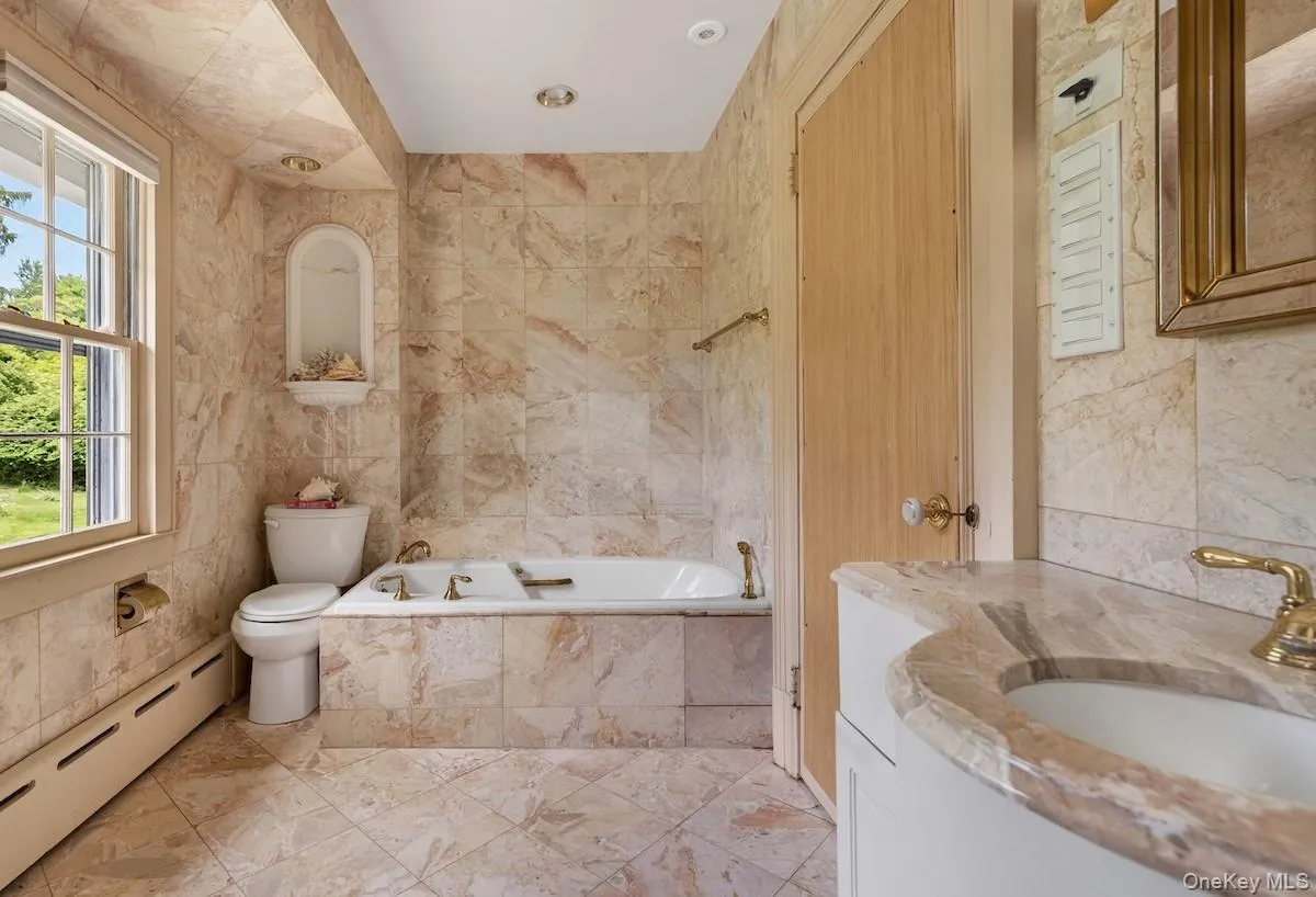 Hall bath adjoins to one of the secondary bedrooms Hall bath adjoins to one of the secondary bedrooms
