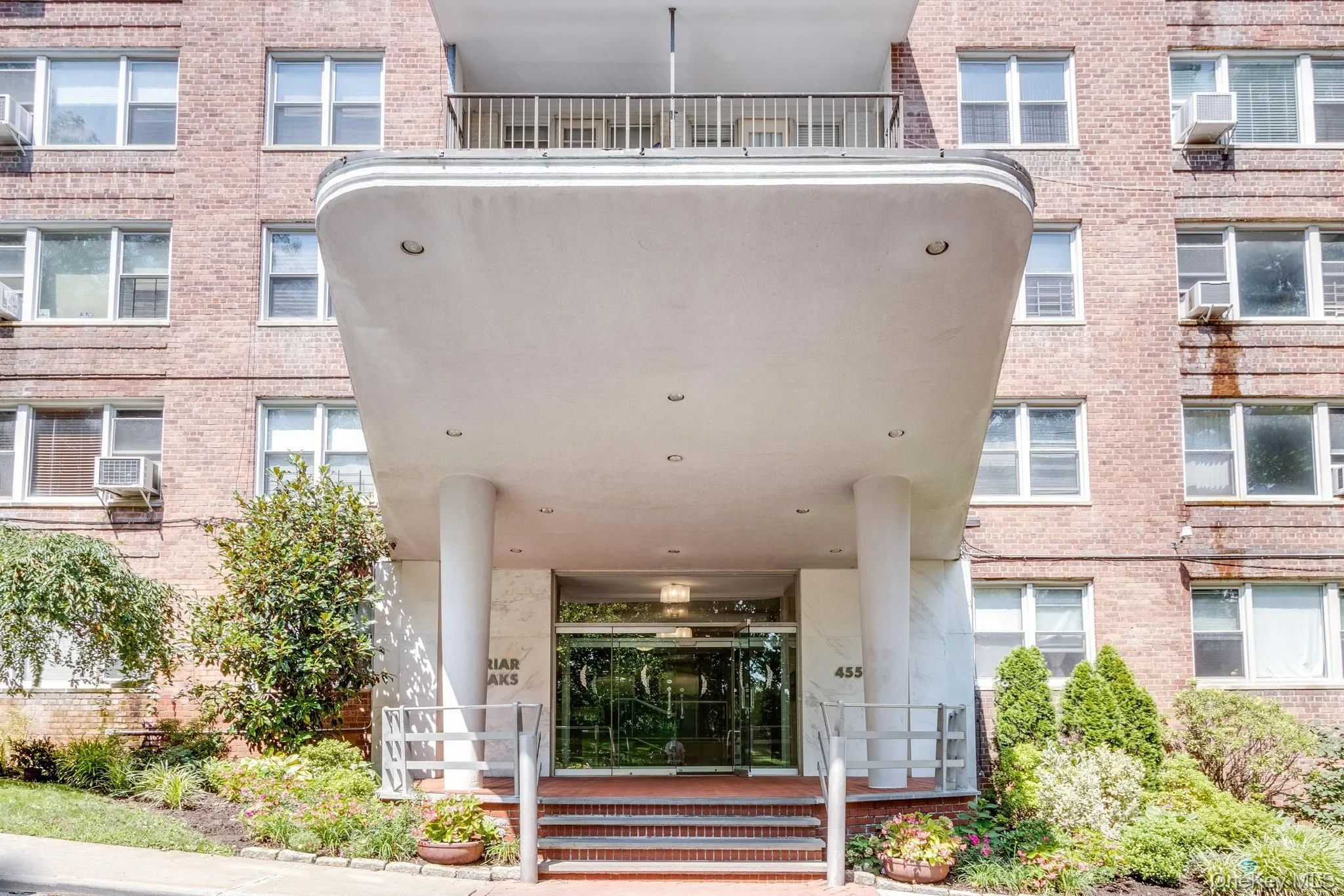 Brick facade building with a prominent rounded portico entrance Brick facade building with a prominent rounded portico entrance