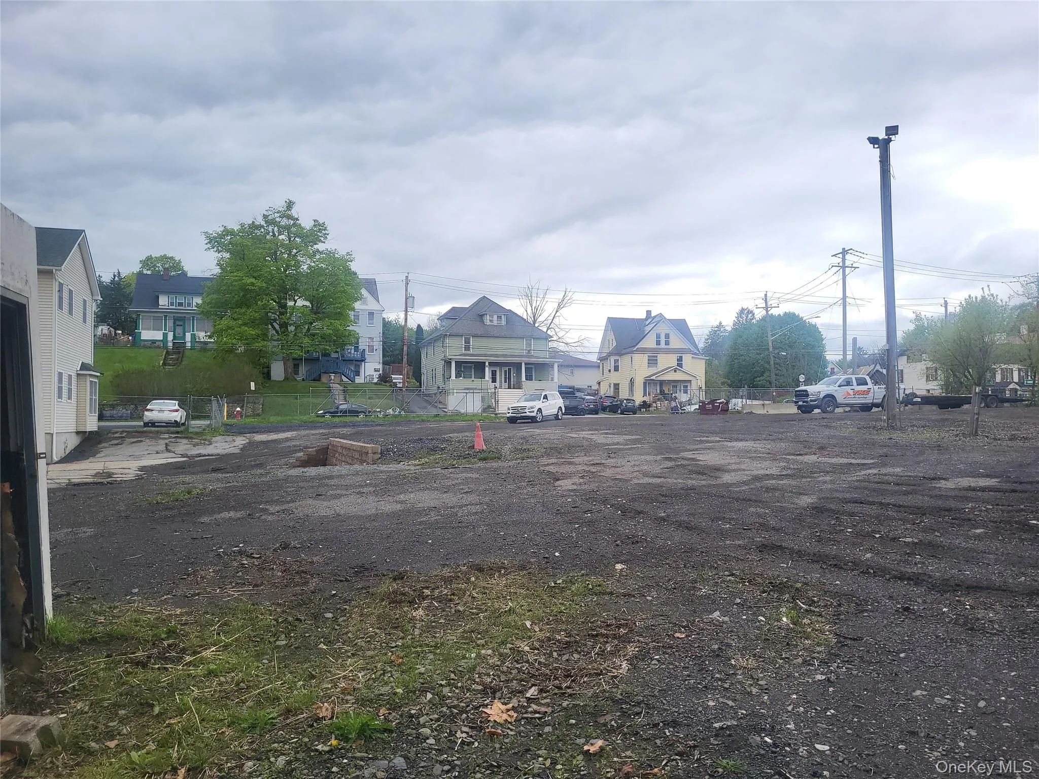 current photo of the fenced industrial lot current photo of the fenced industrial lot