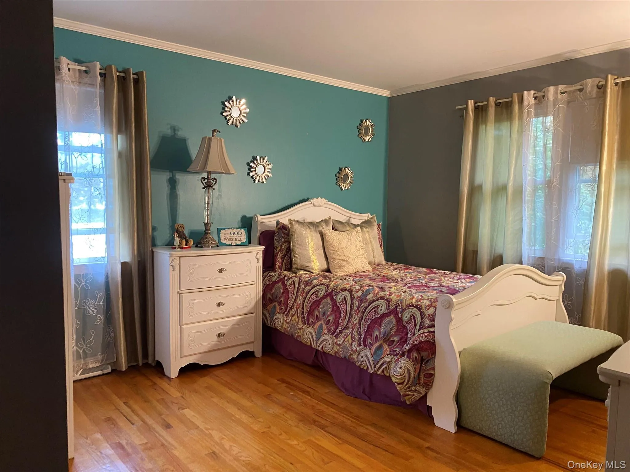 Bedroom #2 with wood flooring and ornamental molding Bedroom #2 with wood flooring and ornamental molding