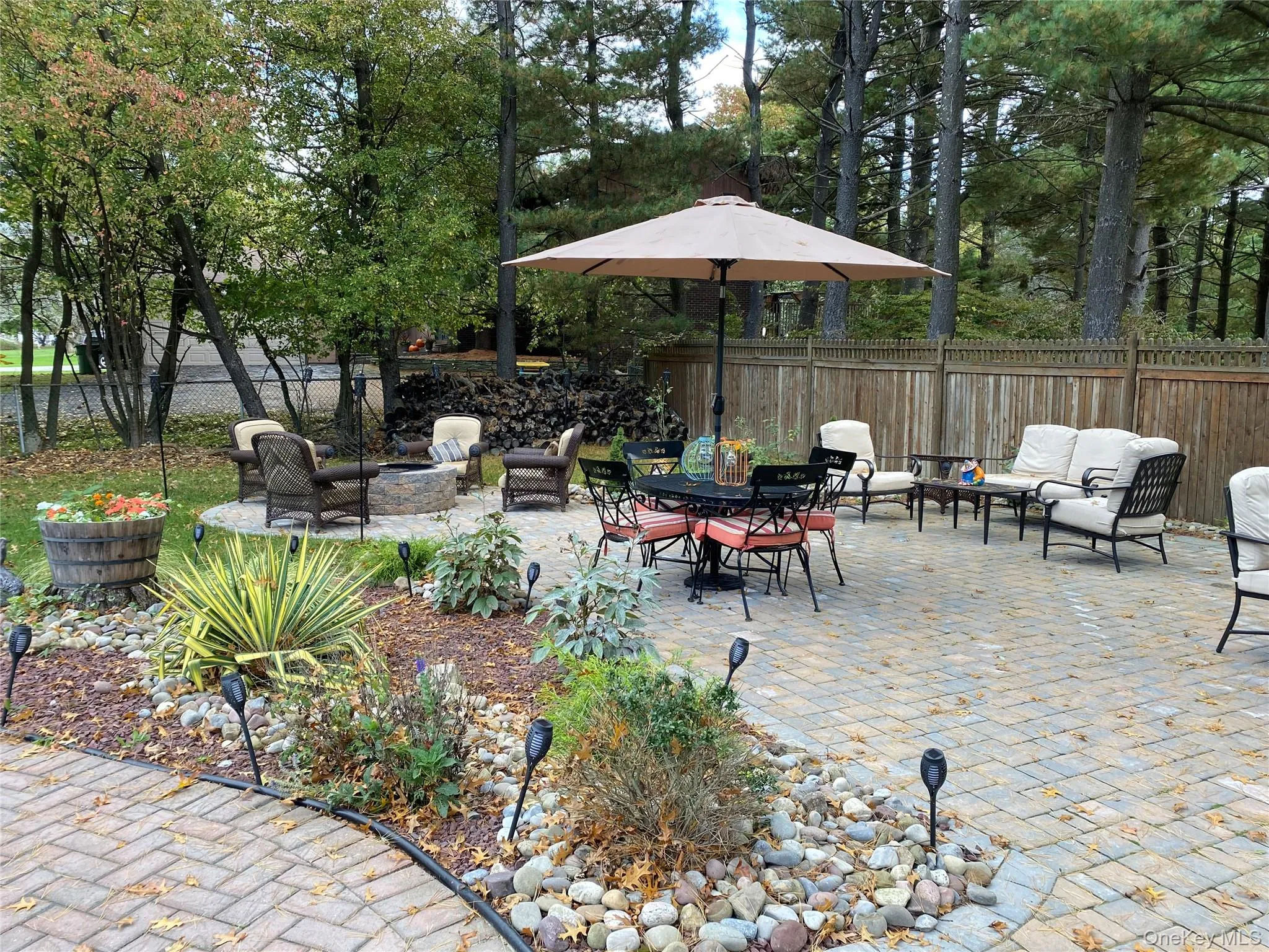 View of patio / terrace featuring an outdoor living space with a fire pit View of patio / terrace featuring an outdoor living space with a fire pit