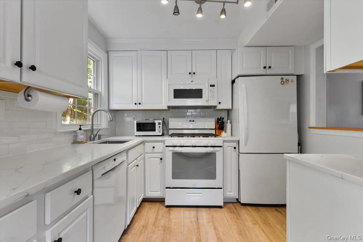 A fully renovated eat in kitchen with an open flow. A fully renovated eat in kitchen with an open flow.