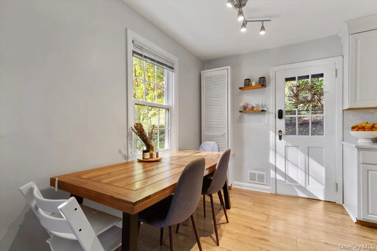 A sunny breakfast nook large enough for a formal dining table. A sunny breakfast nook large enough for a formal dining table.